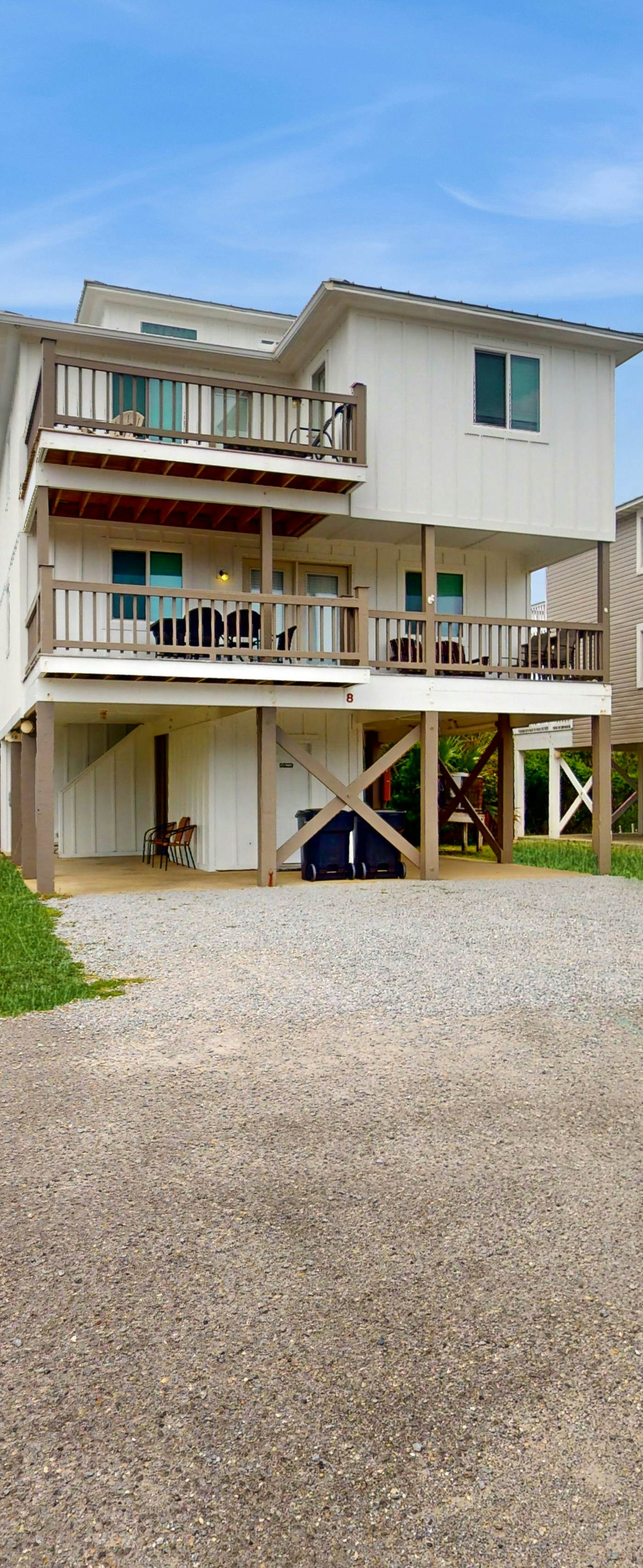 Duplex home with two-level deck, beach access, hot tub, & balcony