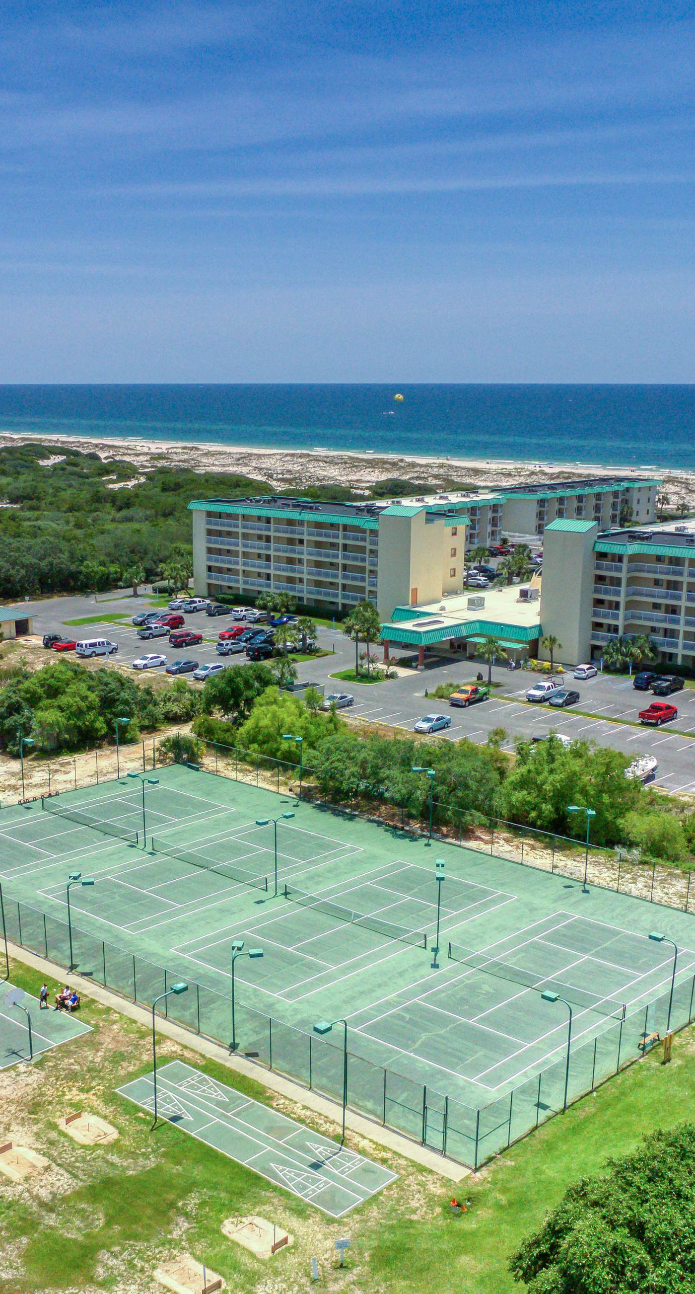 Duplex home with two-level deck, beach access, hot tub, & balcony
