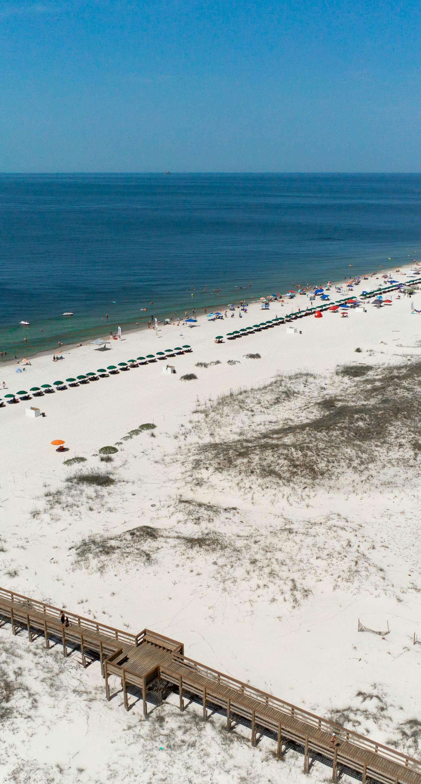 Duplex home with two-level deck, beach access, hot tub, & balcony