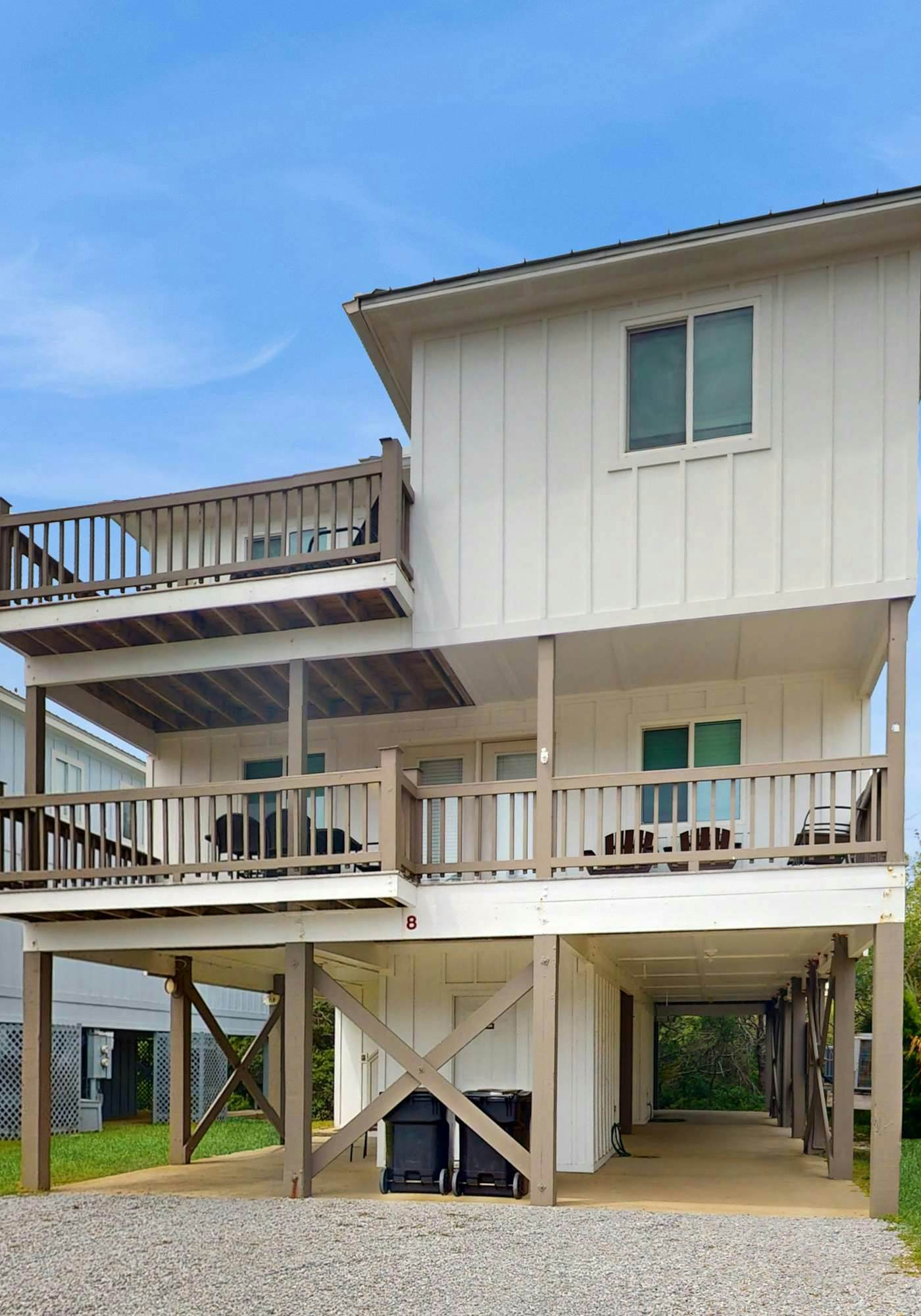 Duplex home with two-level deck, beach access, hot tub, & balcony