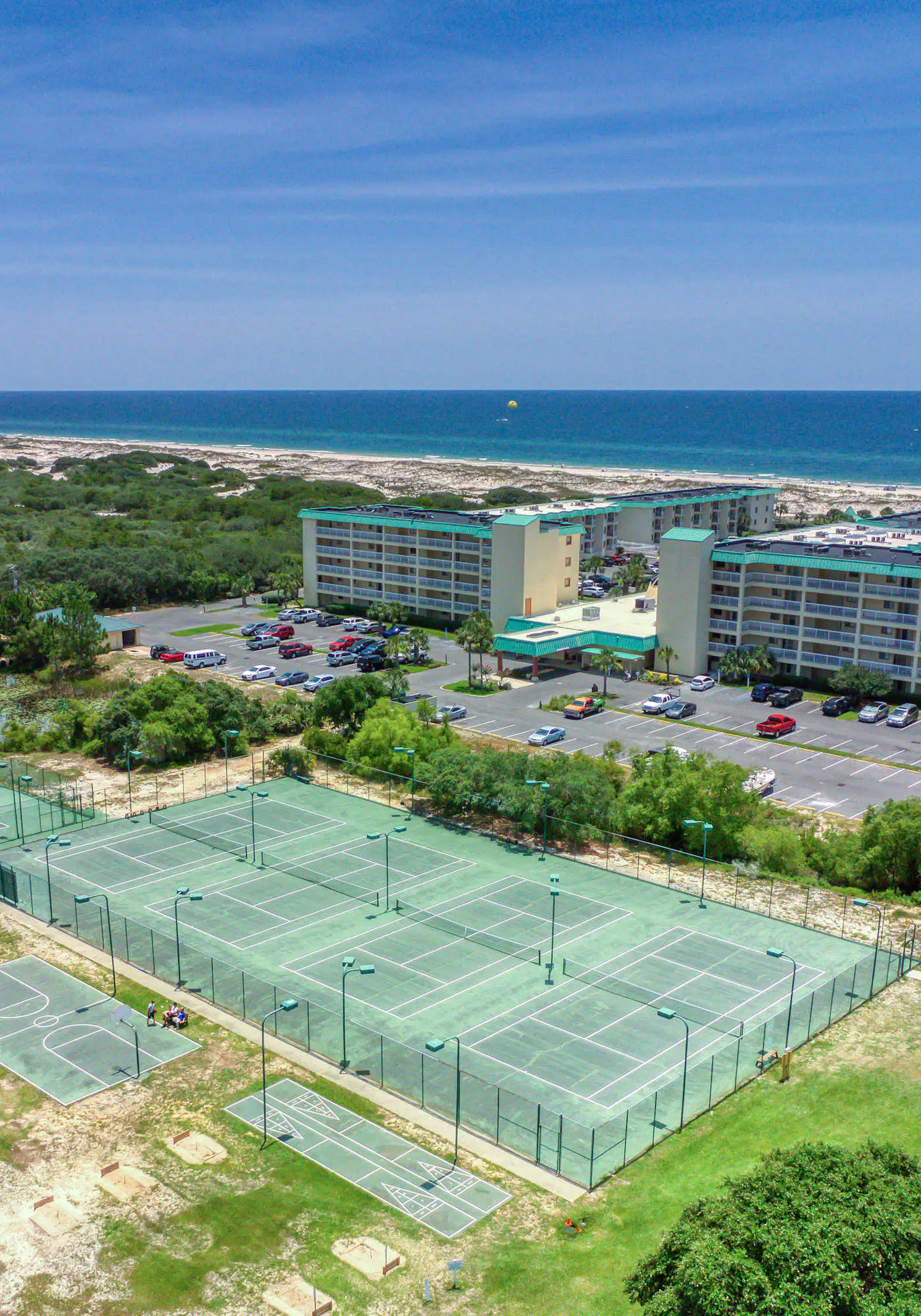 Duplex home with two-level deck, beach access, hot tub, & balcony