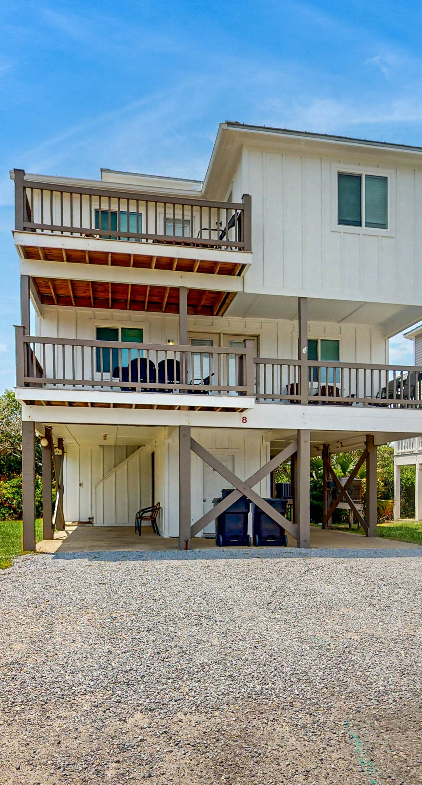 Gulf view home with two-level deck, beach access & shared pools, hot tub, gym