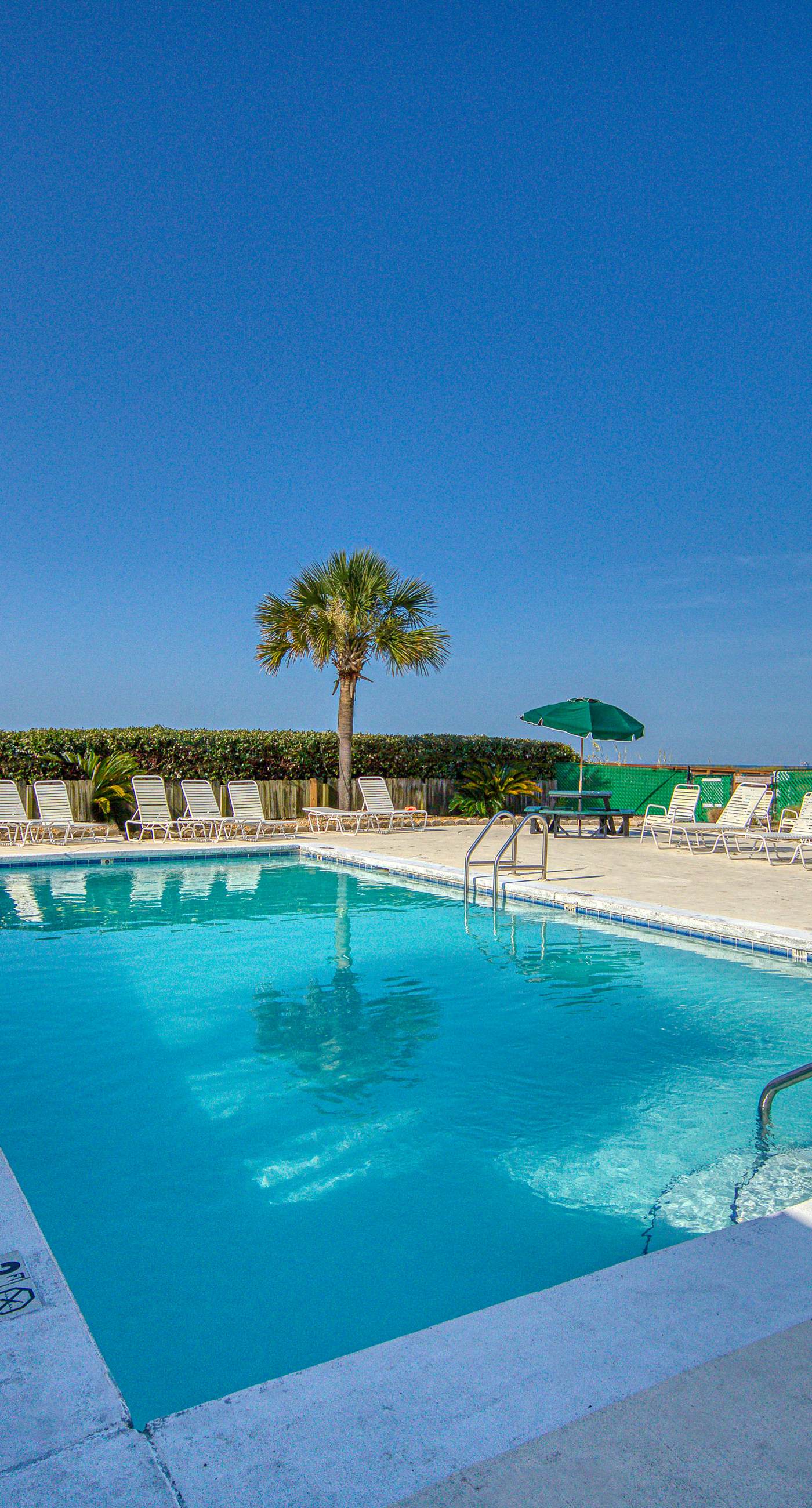 Gulf view home with two-level deck, beach access & shared pools, hot tub, gym