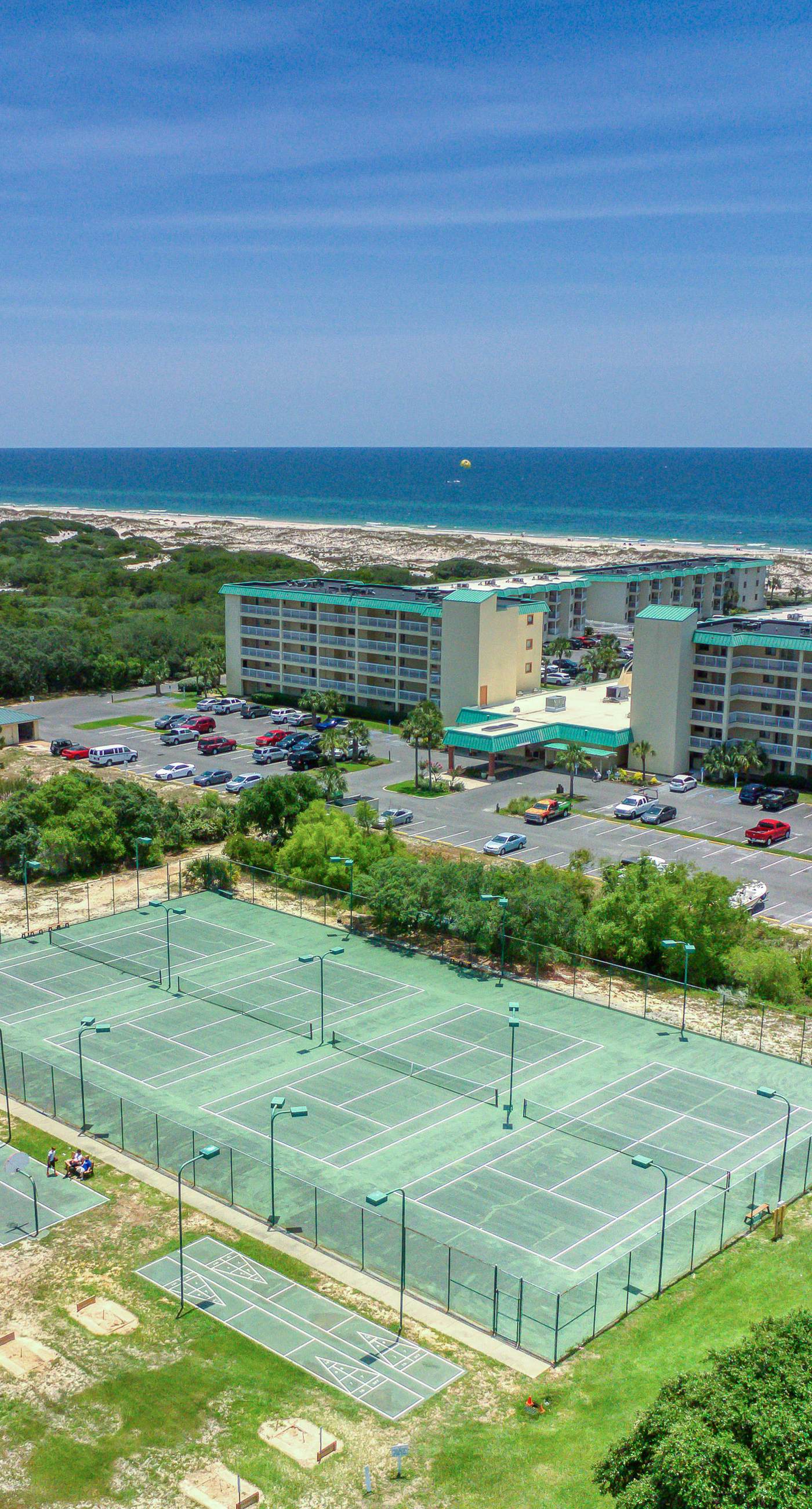 Gulf view home with two-level deck, beach access & shared pools, hot tub, gym