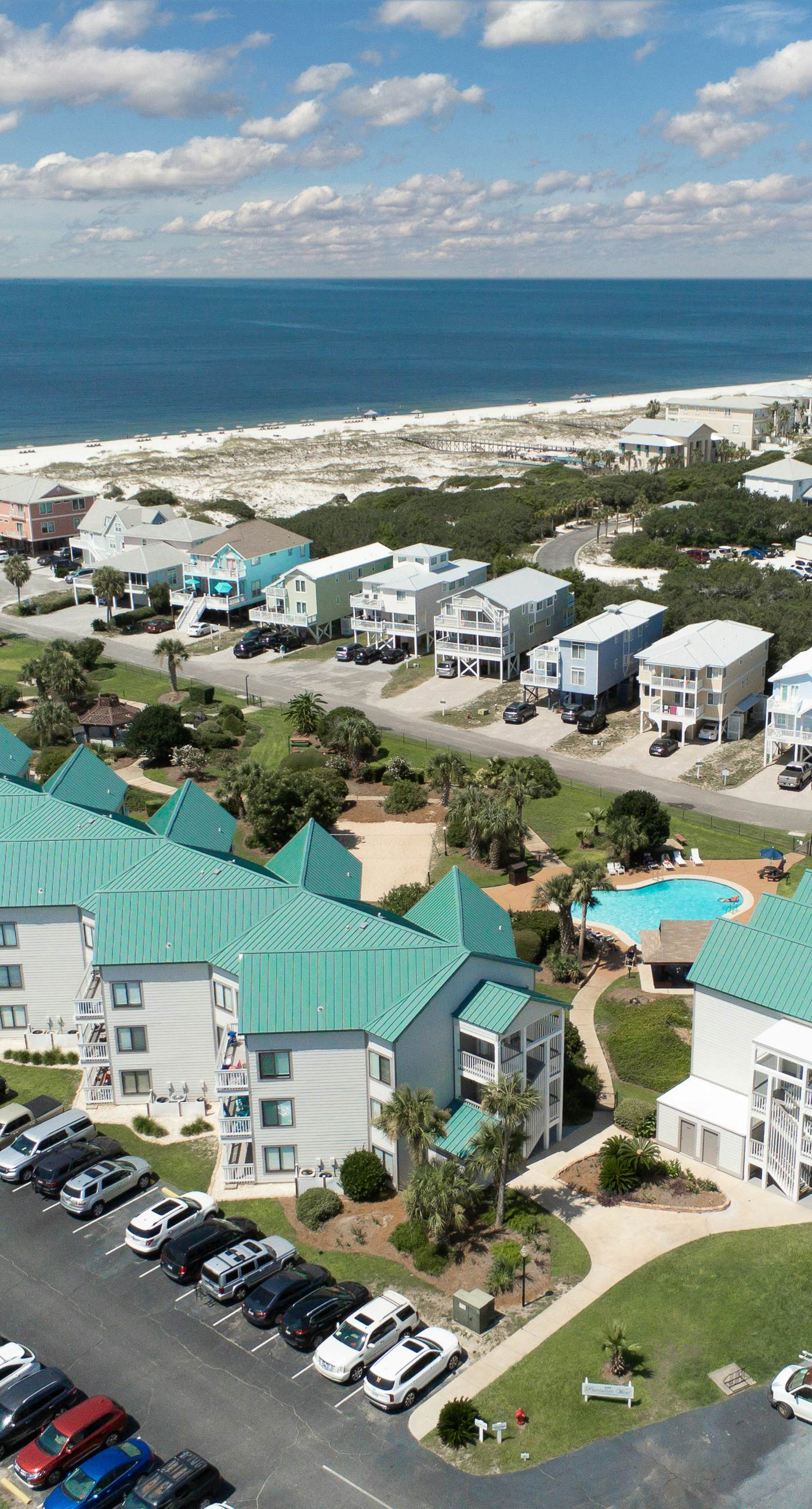 Gulf view home with two-level deck, beach access & shared pools, hot tub, gym