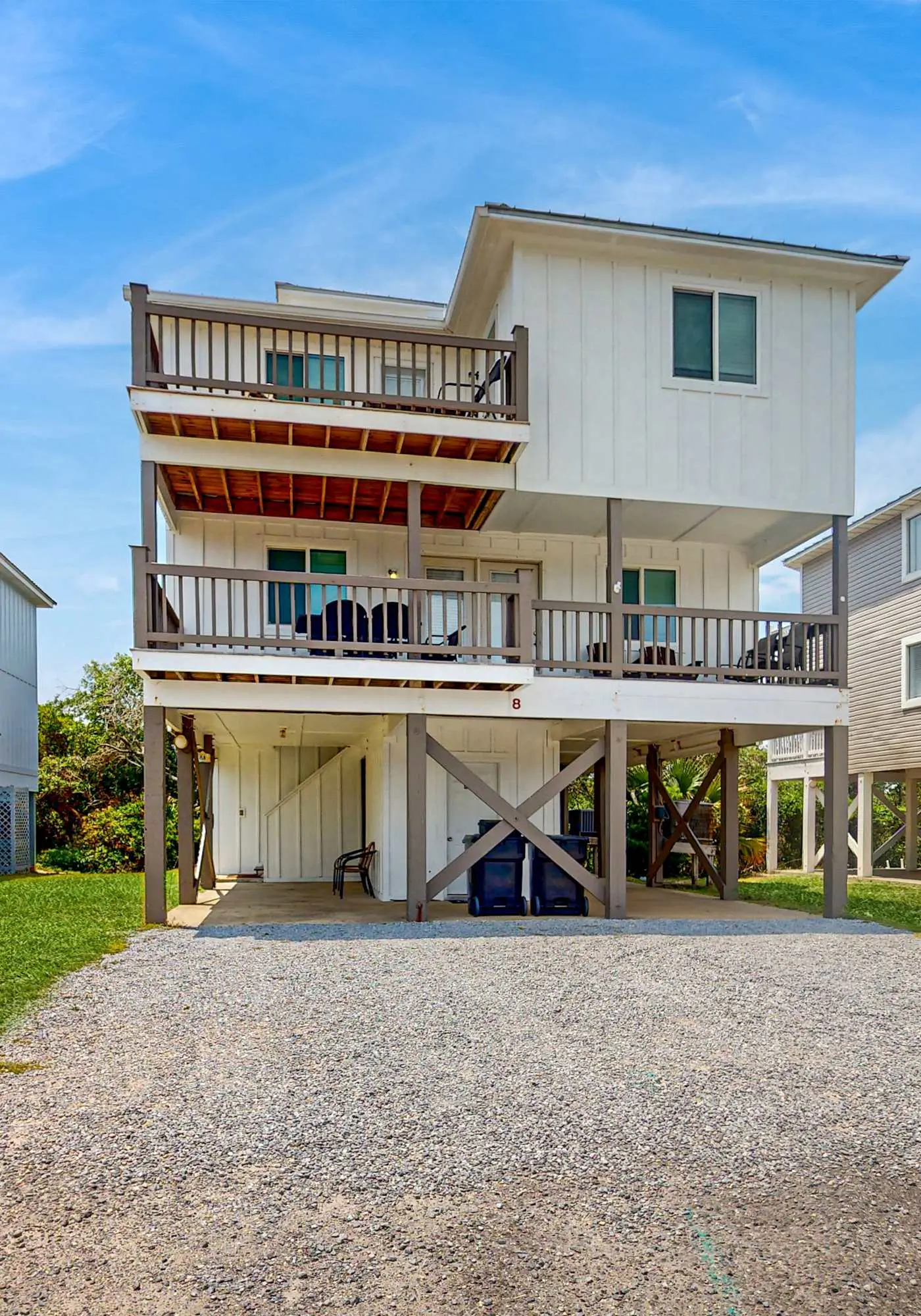 Gulf view home with two-level deck, beach access & shared pools, hot tub, gym