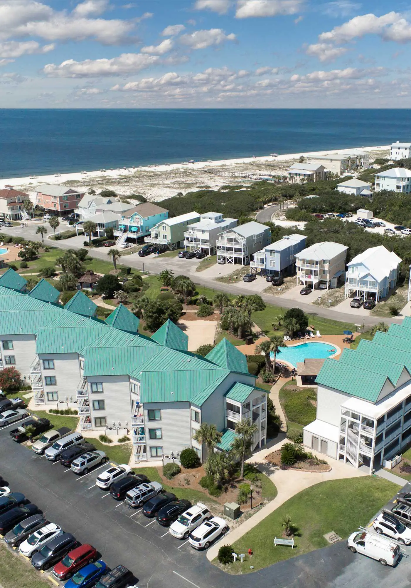 Gulf view home with two-level deck, beach access & shared pools, hot tub, gym