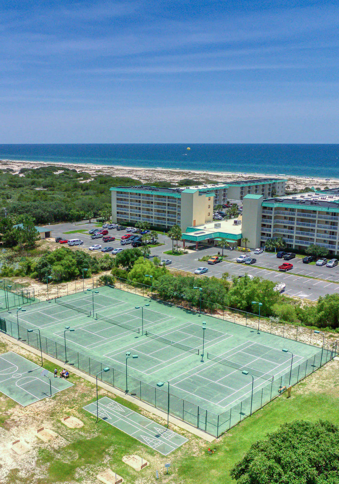 Gulf view home with two-level deck, beach access & shared pools, hot tub, gym