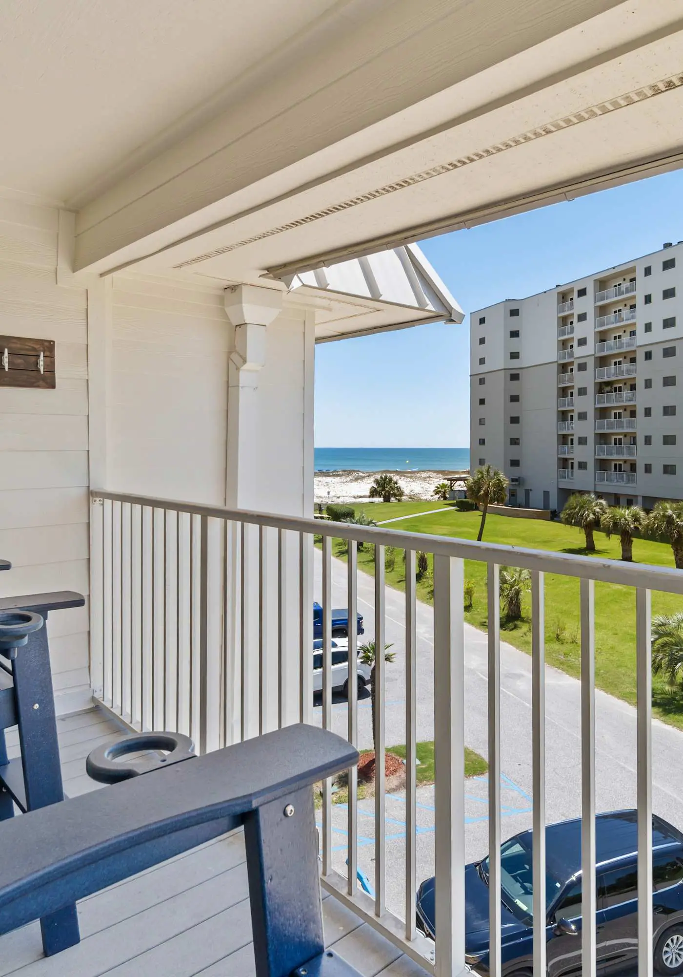 Third-floor condo with pool, hot tub, partial ocean view, gym, & central AC