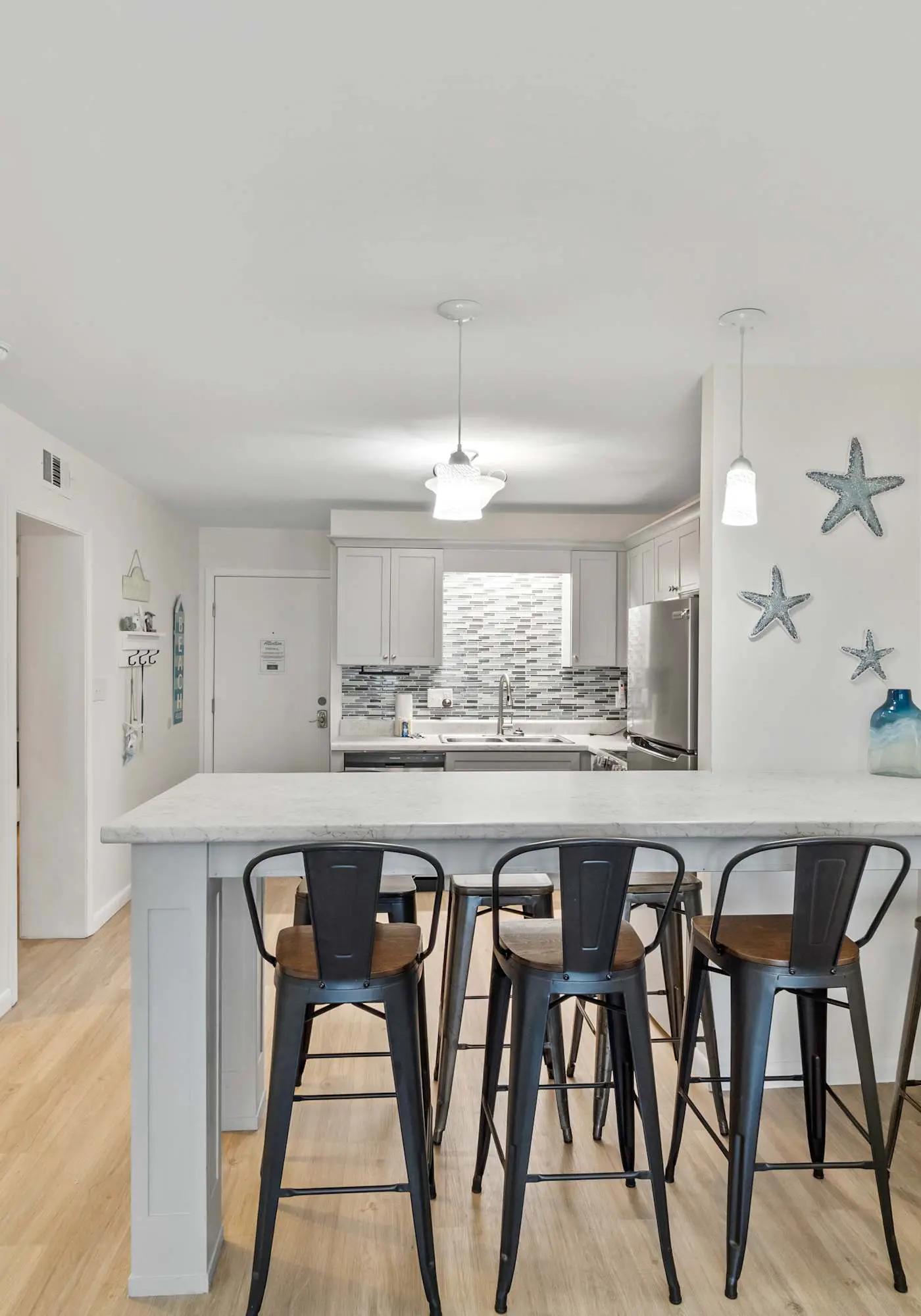 Third-floor condo with pool, hot tub, partial ocean view, gym, & central AC