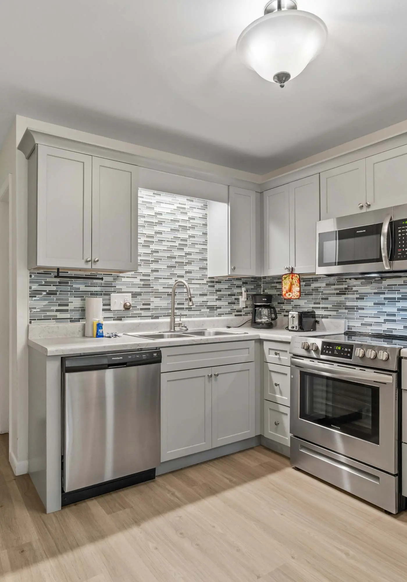 Third-floor condo with pool, hot tub, partial ocean view, gym, & central AC