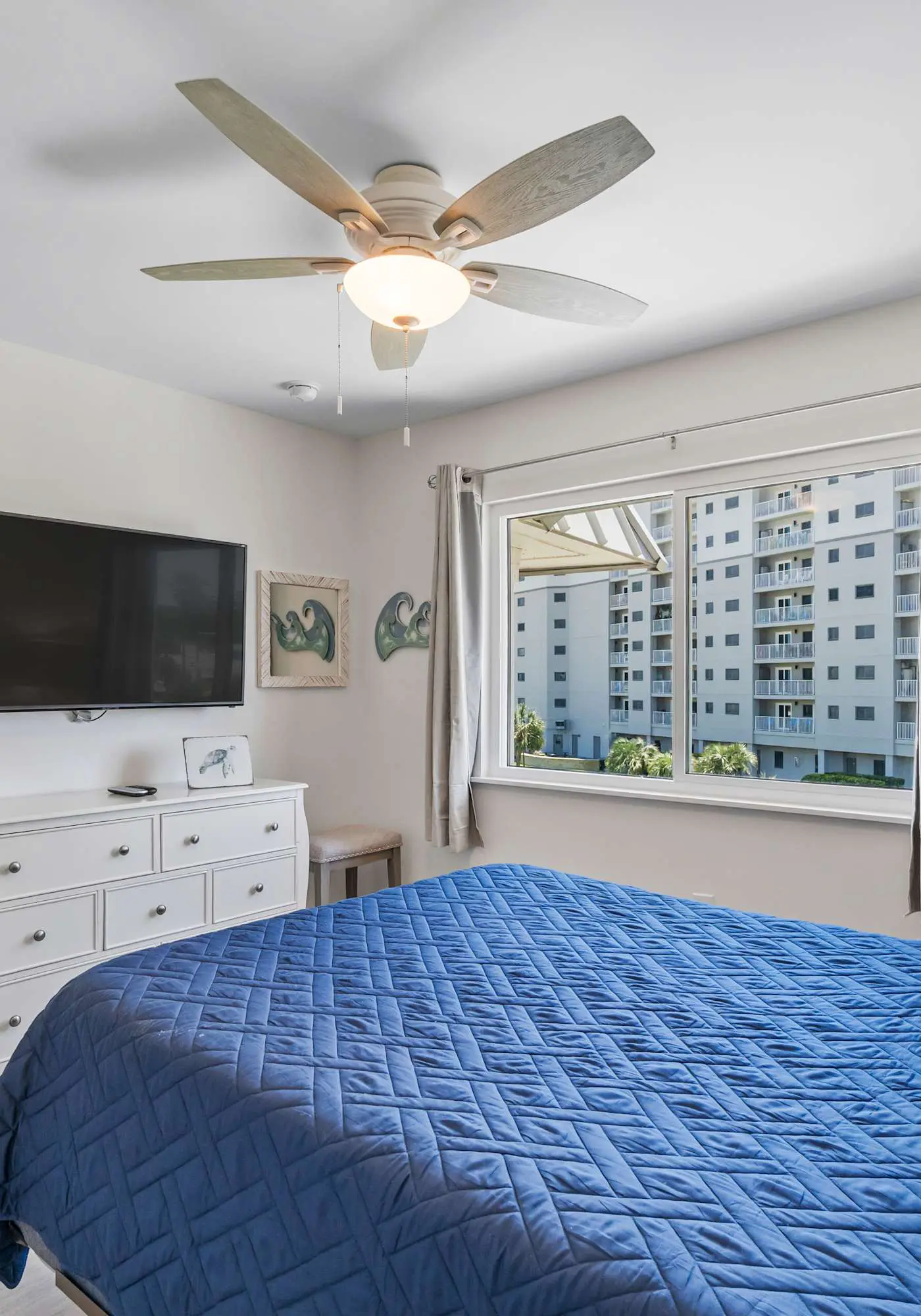 Third-floor condo with pool, hot tub, partial ocean view, gym, & central AC