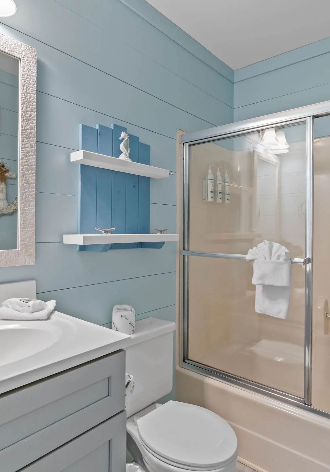 Third-floor condo with pool, hot tub, partial ocean view, gym, & central AC