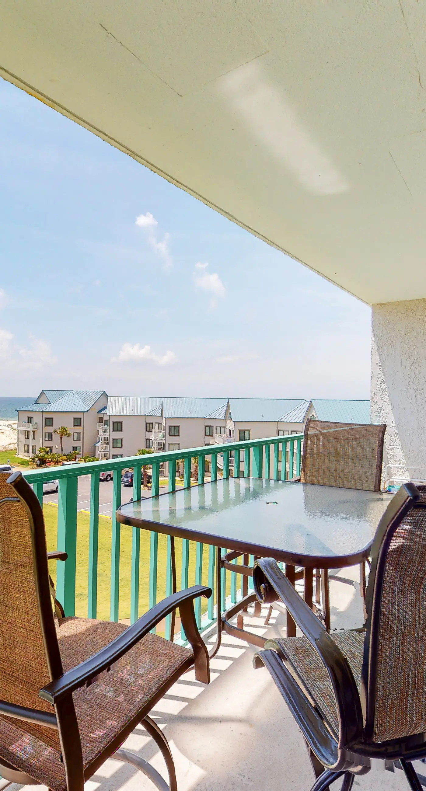 Oceanfront condo with Gulf-view balcony, beach access, pool, WiFi, & central AC
