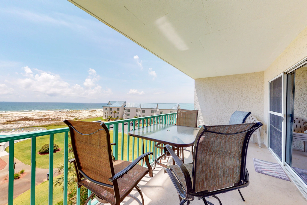 Oceanfront condo with Gulf-view balcony, beach access, pool, WiFi, & central AC