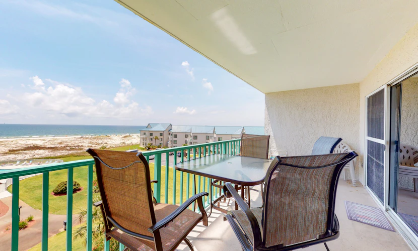 Oceanfront condo with Gulf-view balcony, beach access, pool, WiFi, & central AC