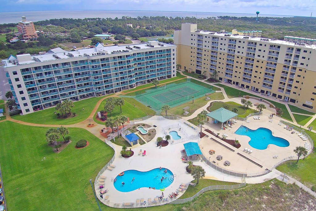 Oceanfront condo with Gulf-view balcony, beach access, pool, WiFi, & central AC