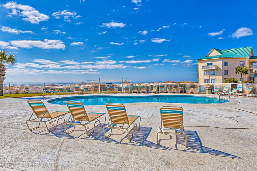 Oceanfront condo with Gulf-view balcony, beach access, pool, WiFi, & central AC