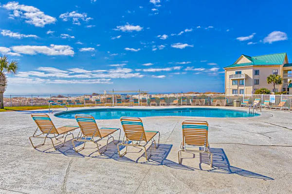 Oceanfront condo with Gulf-view balcony, beach access, pool, WiFi, & central AC