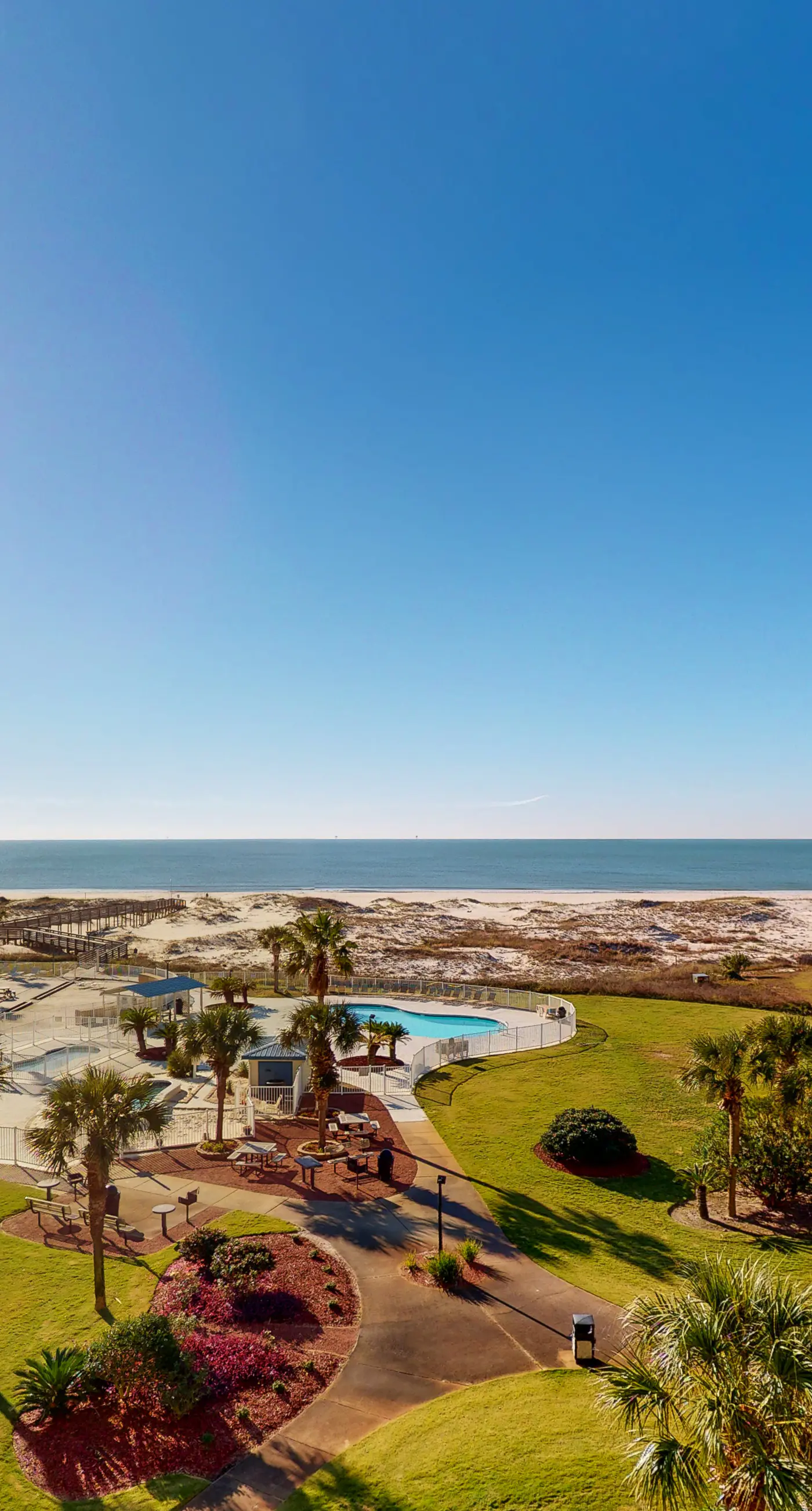 Oceanfront condo with Gulf-view balcony, beach access, pool, WiFi, & central AC