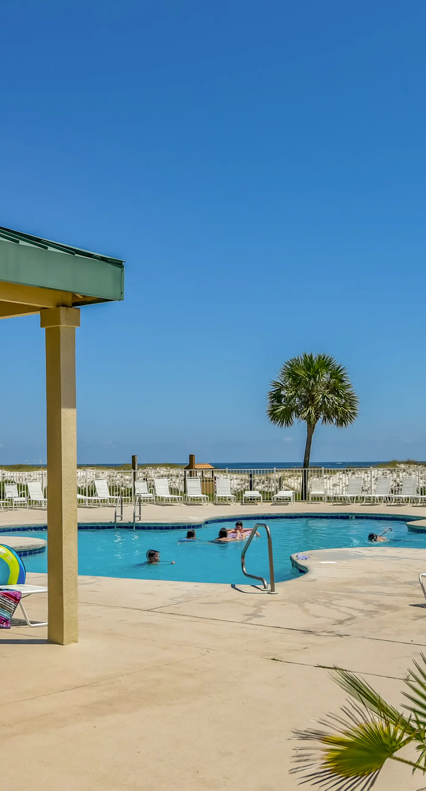 Oceanfront condo with Gulf-view balcony, beach access, pool, WiFi, & central AC