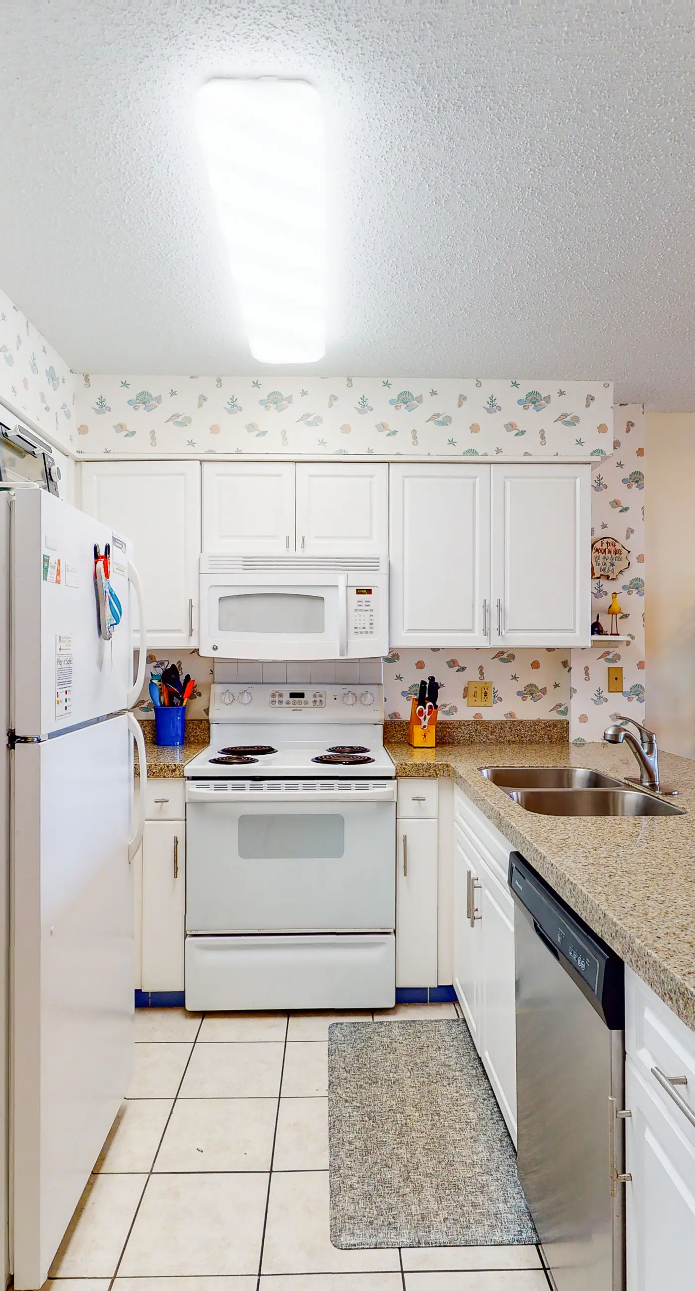 Oceanfront condo with Gulf-view balcony, beach access, pool, WiFi, & central AC