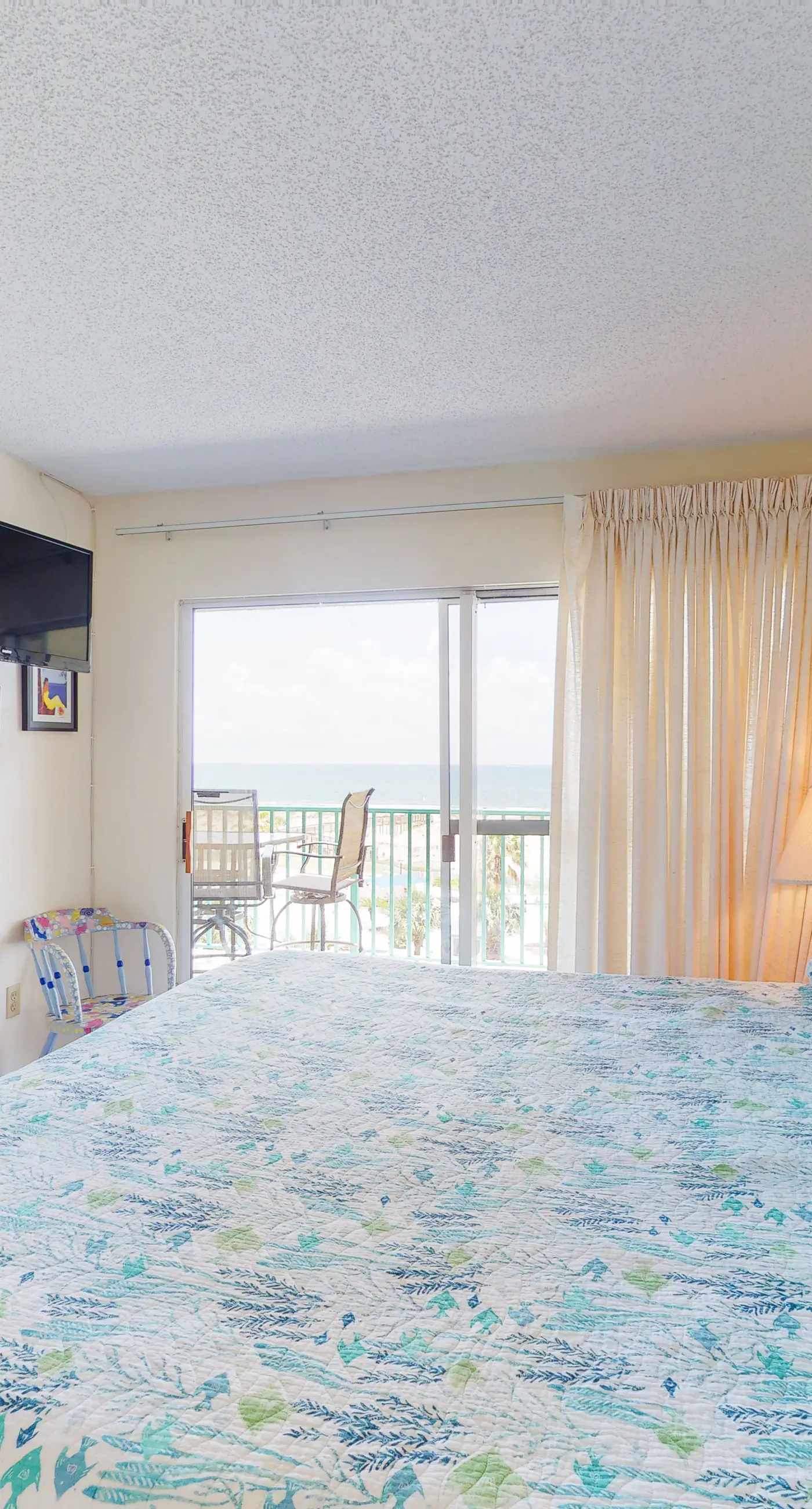 Oceanfront condo with Gulf-view balcony, beach access, pool, WiFi, & central AC