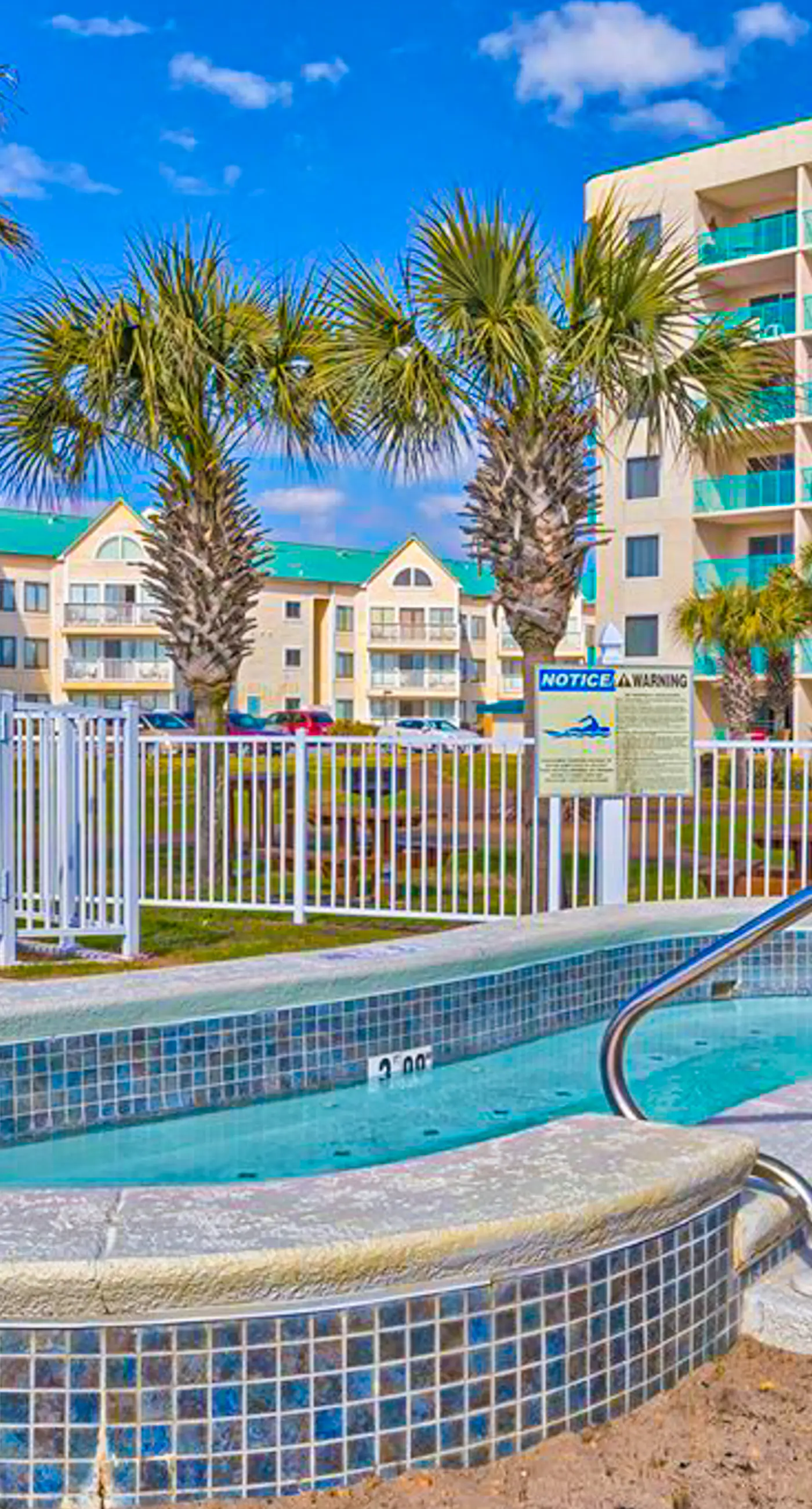 Oceanfront condo with Gulf-view balcony, beach access, pool, WiFi, & central AC