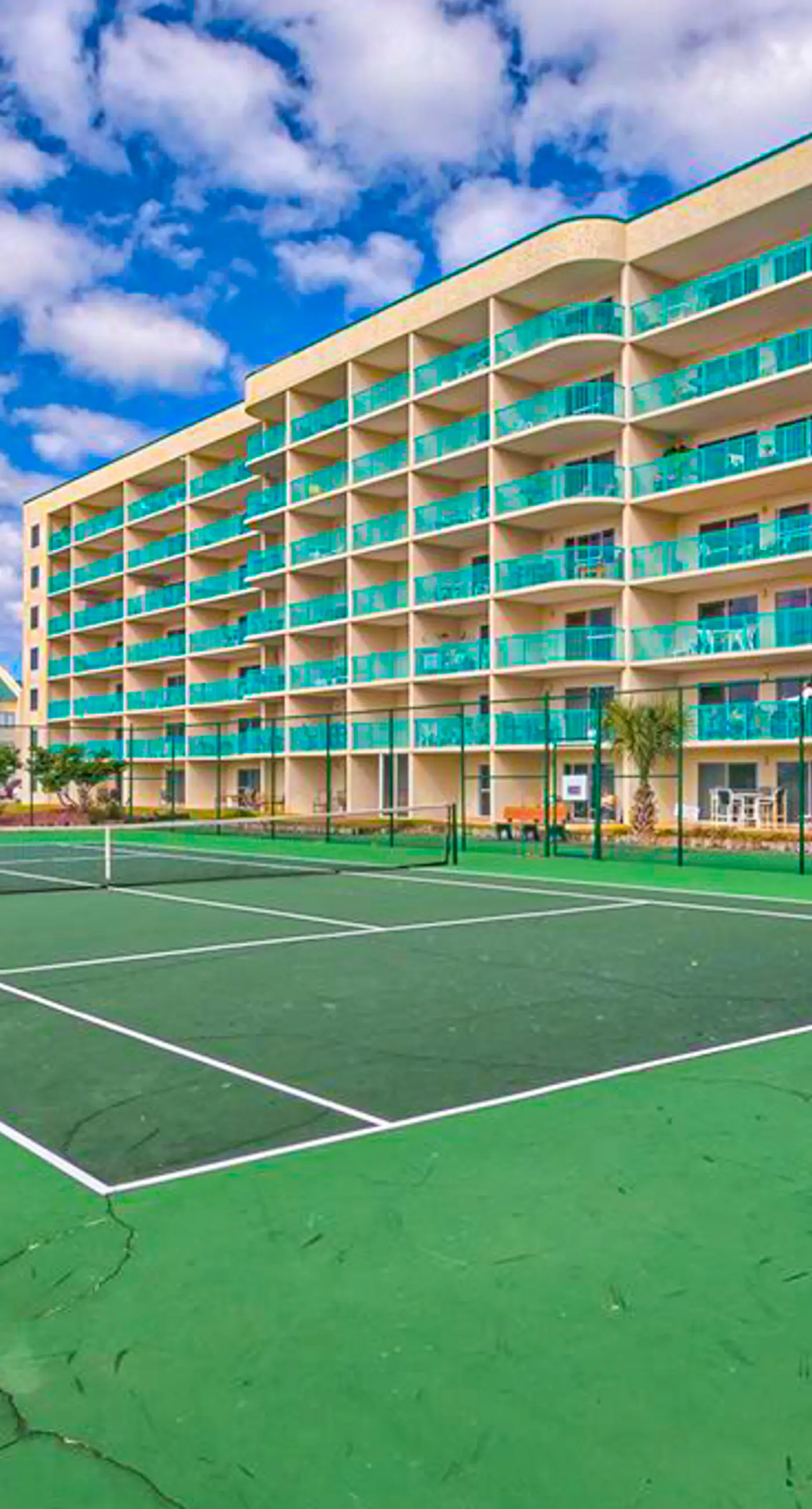 Oceanfront condo with Gulf-view balcony, beach access, pool, WiFi, & central AC