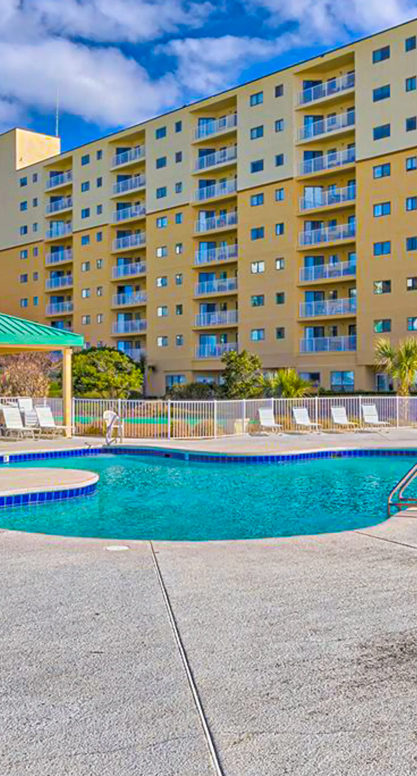 Oceanfront condo with Gulf-view balcony, beach access, pool, WiFi, & central AC