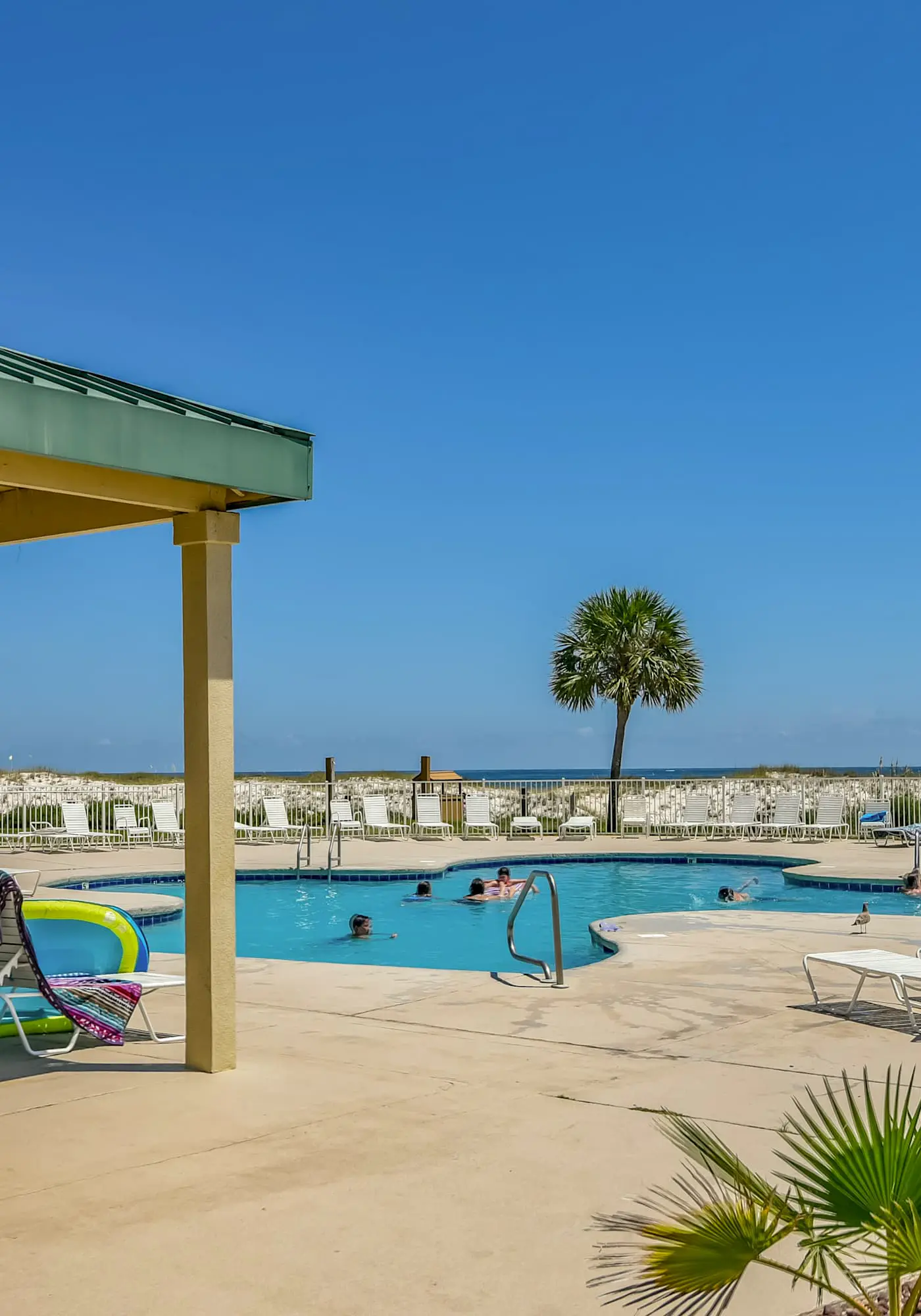 Oceanfront condo with Gulf-view balcony, beach access, pool, WiFi, & central AC