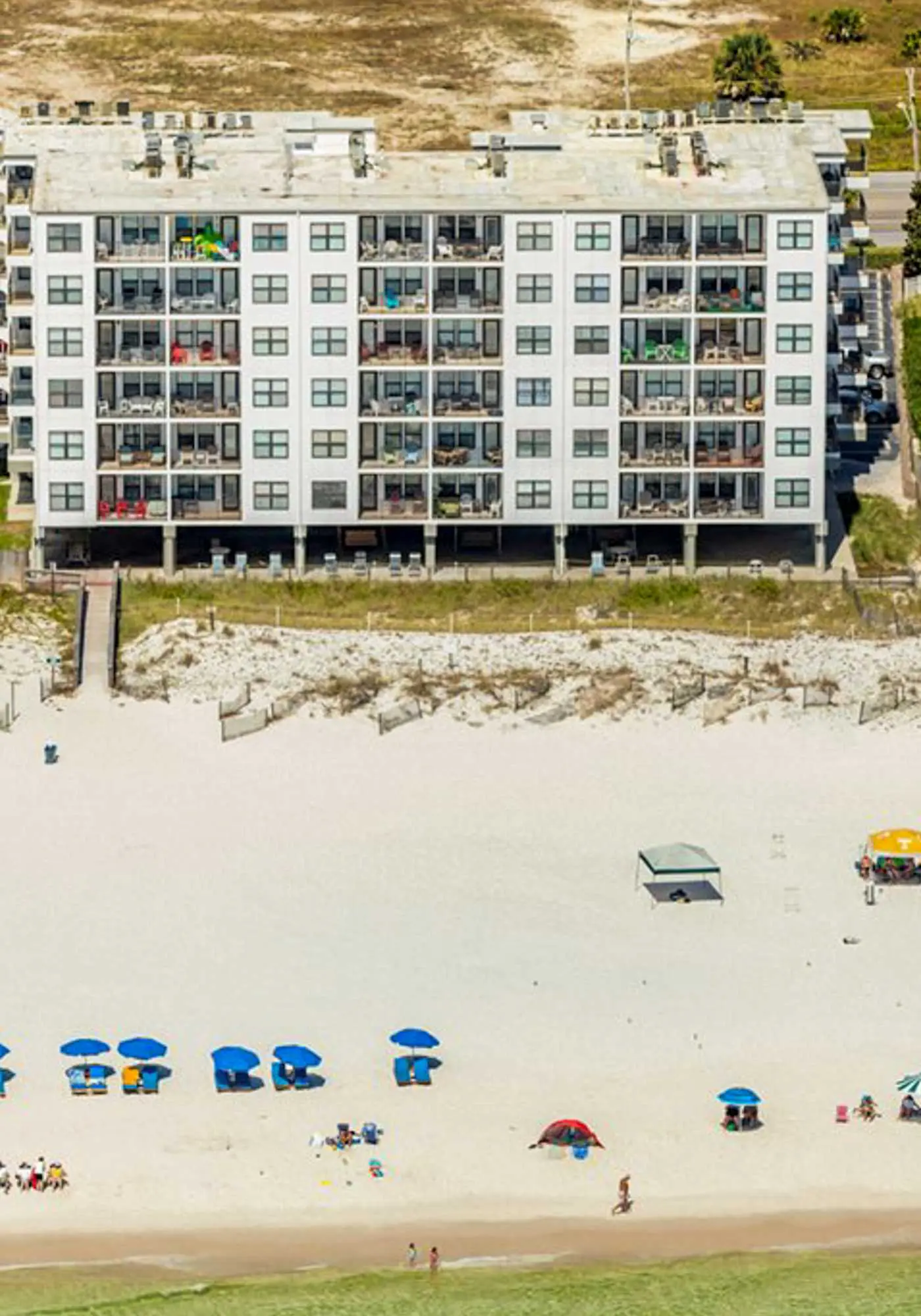 Waterfront condo with a full kitchen, pool, & beach access