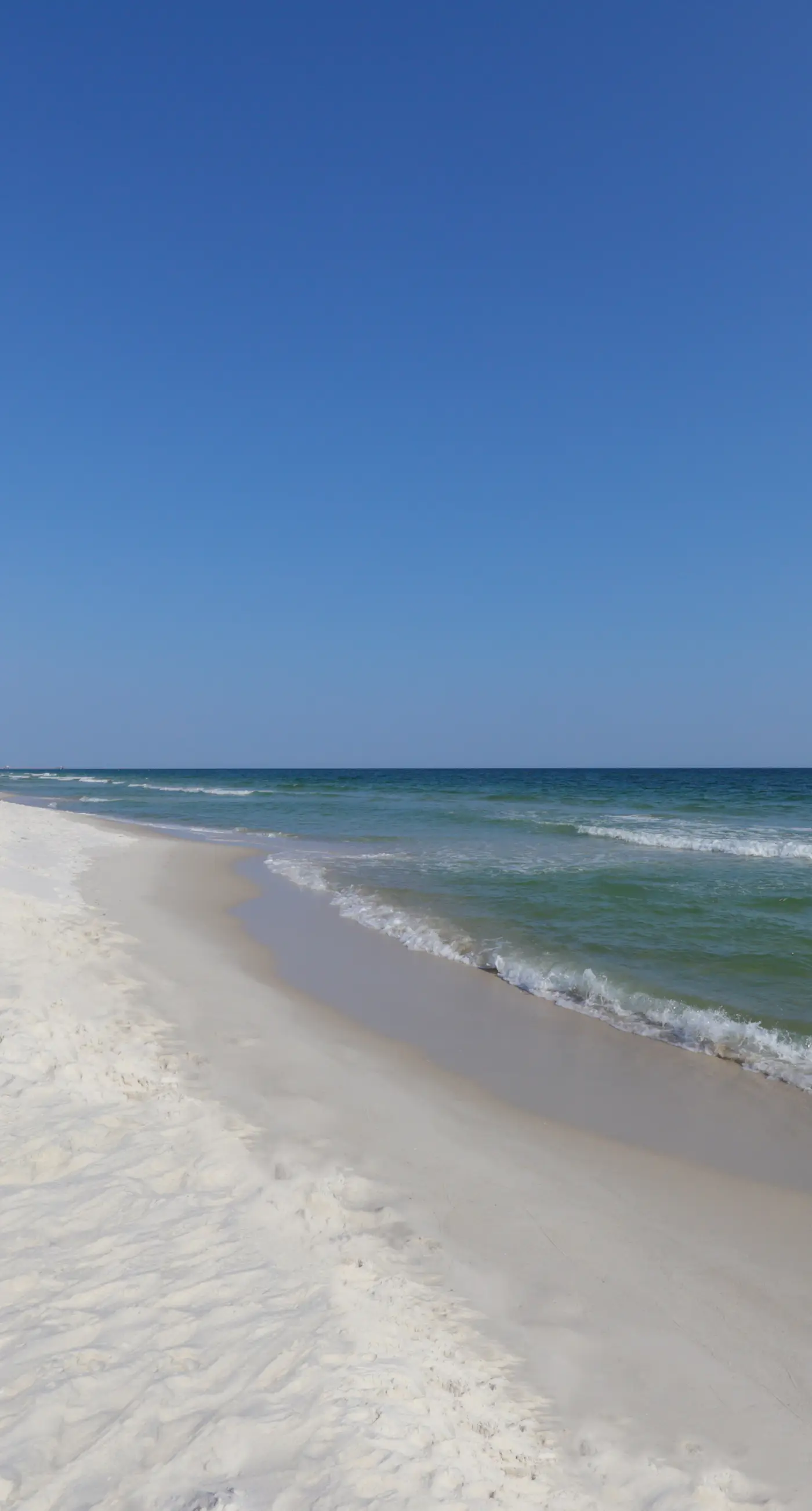 Waterfront condo with a furnished balcony, peek-a-boo Gulf views, & shared pools