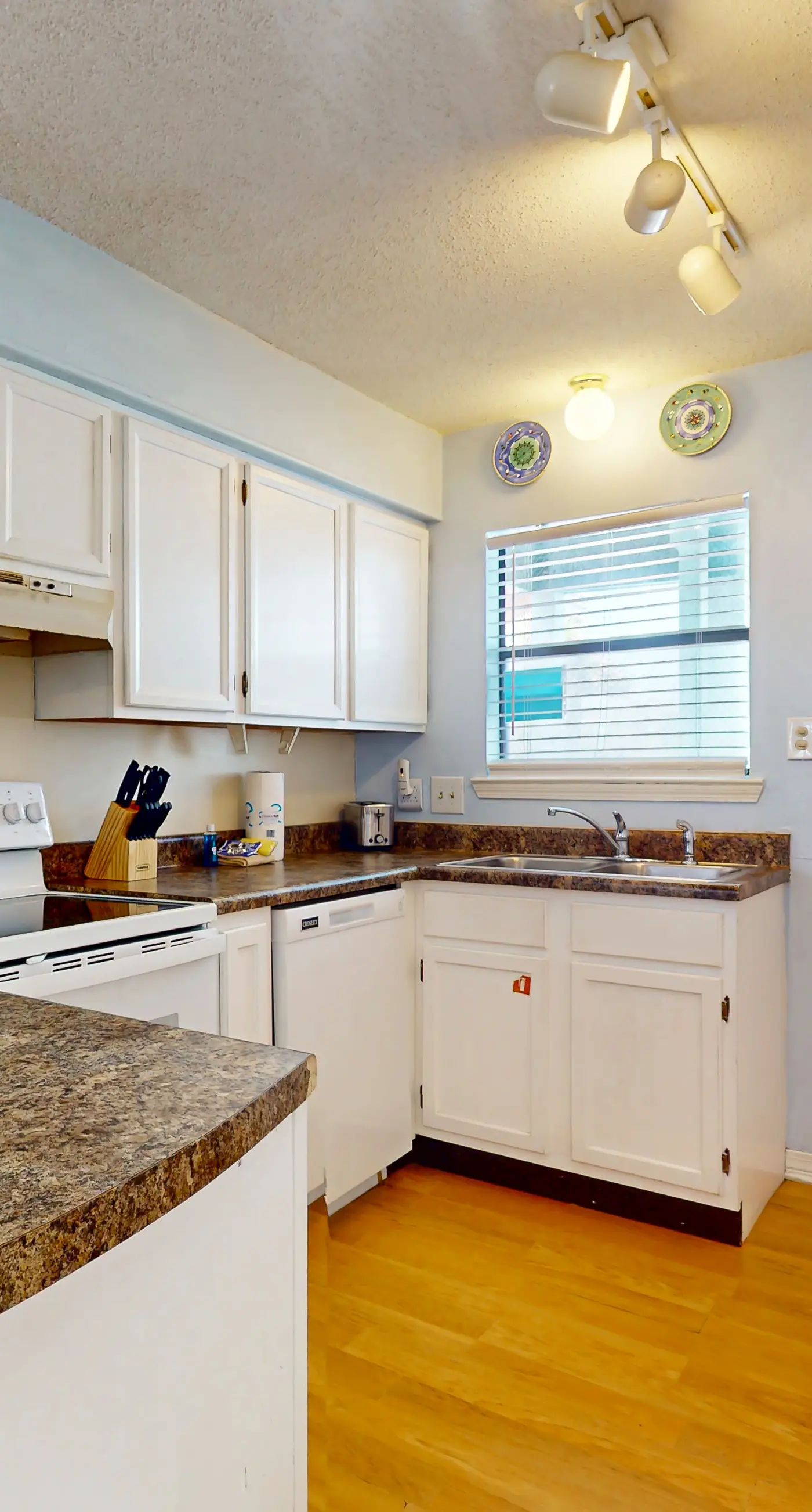 Waterfront condo with a furnished balcony, peek-a-boo Gulf views, & shared pools