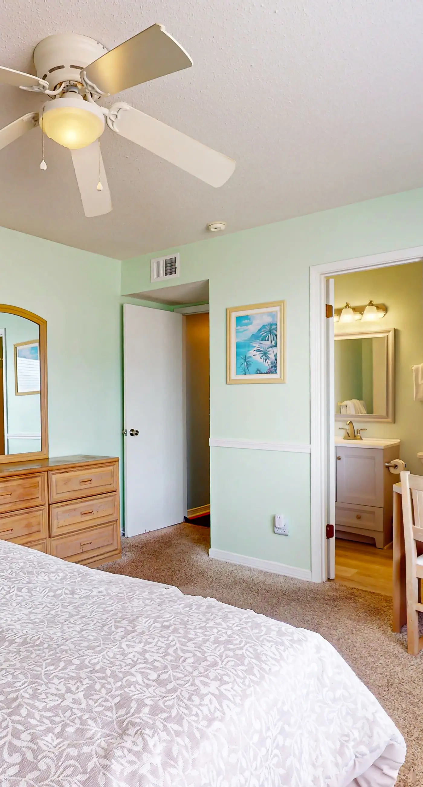 Waterfront condo with a furnished balcony, peek-a-boo Gulf views, & shared pools