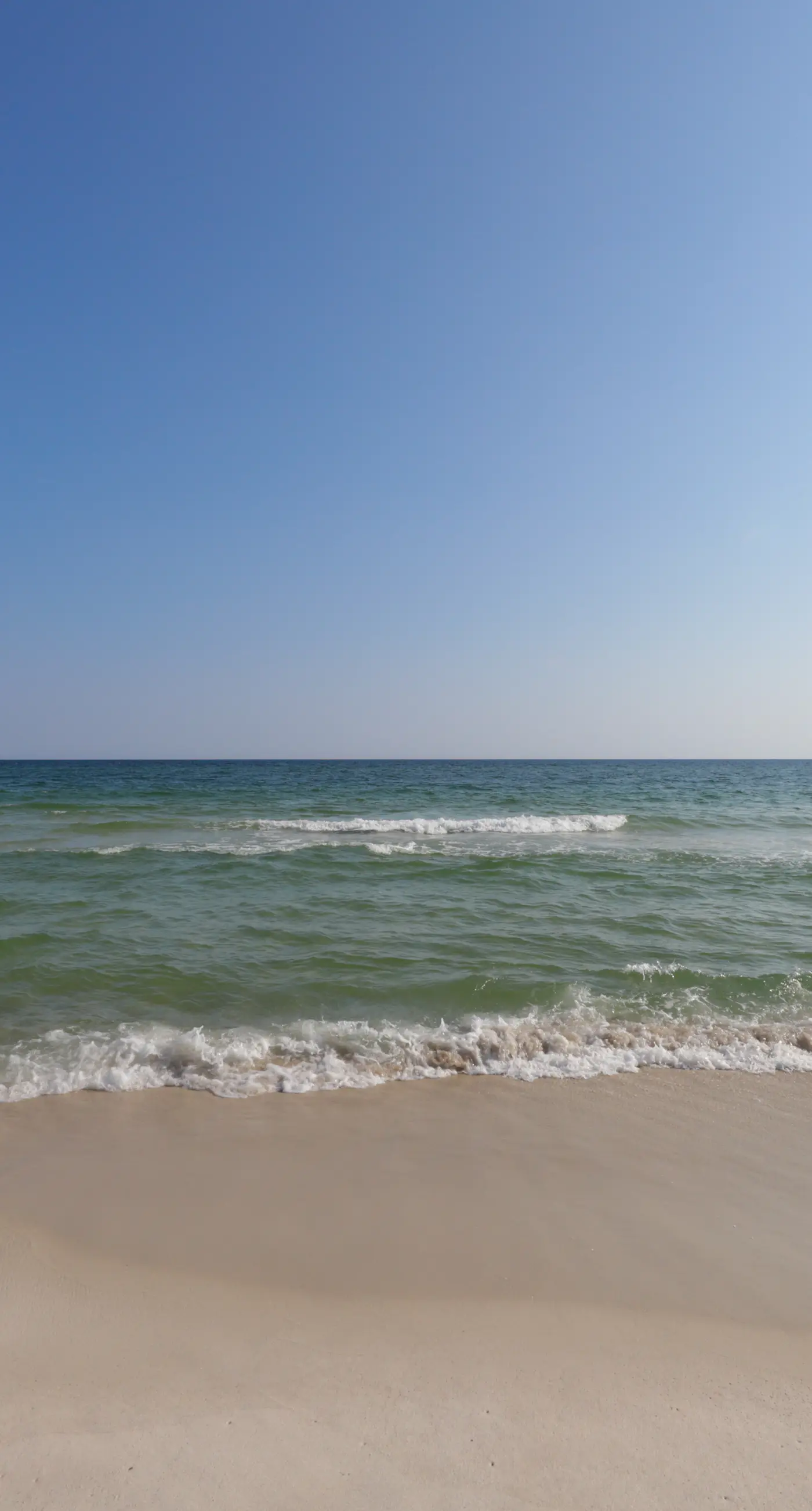 Waterfront condo with a furnished balcony, peek-a-boo Gulf views, & shared pools