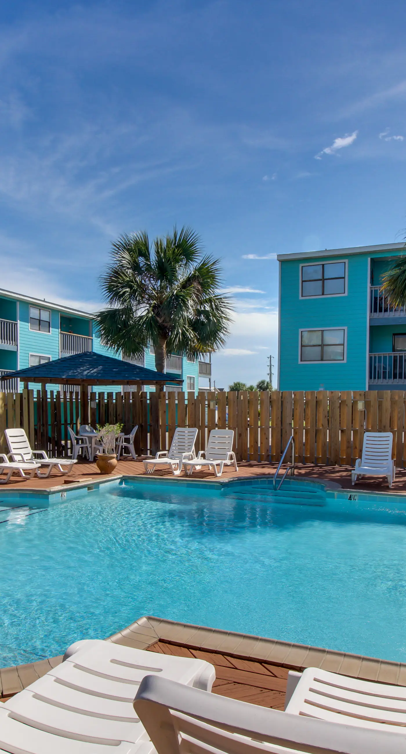 Waterfront condo with a furnished balcony, peek-a-boo Gulf views, & shared pools