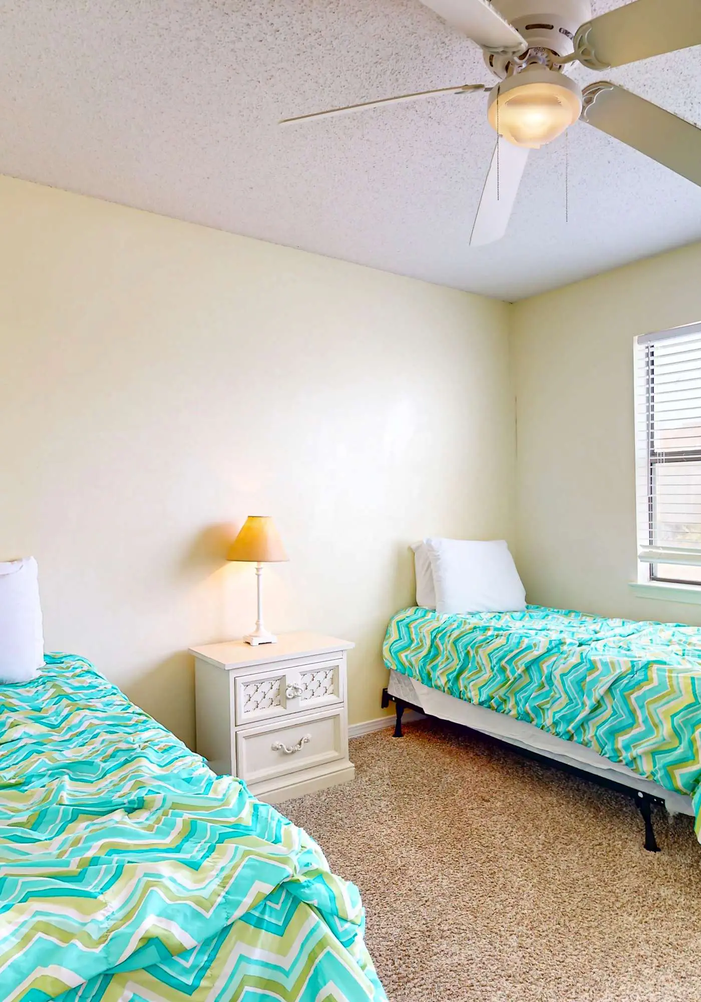 Waterfront condo with a furnished balcony, peek-a-boo Gulf views, & shared pools