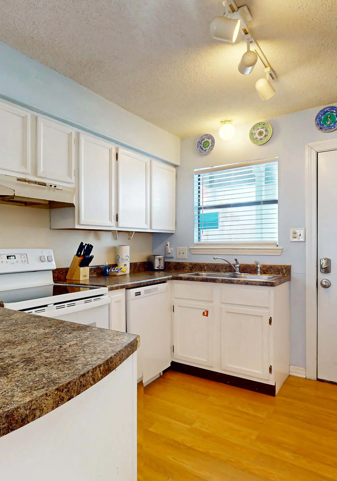 Waterfront condo with a furnished balcony, peek-a-boo Gulf views, & shared pools