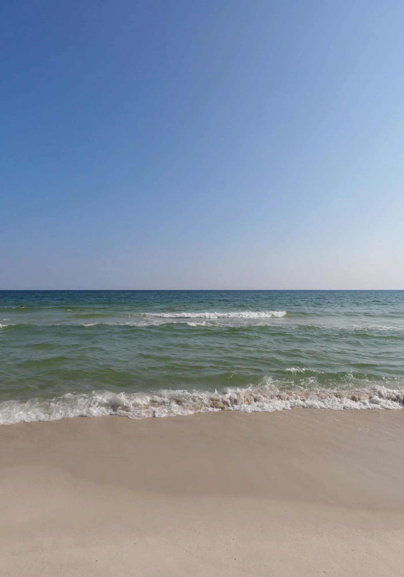 Waterfront condo with a furnished balcony, peek-a-boo Gulf views, & shared pools