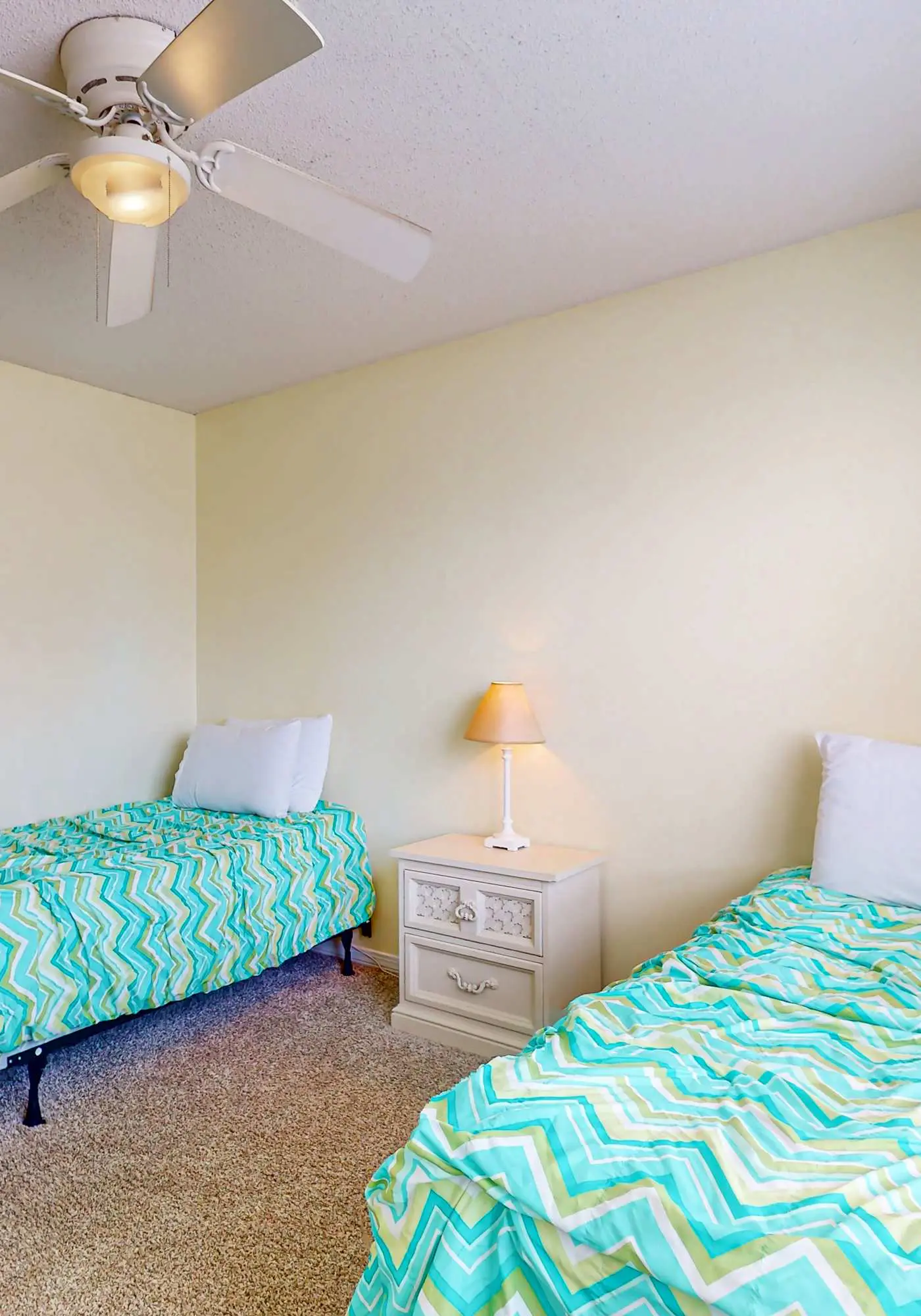 Waterfront condo with a furnished balcony, peek-a-boo Gulf views, & shared pools