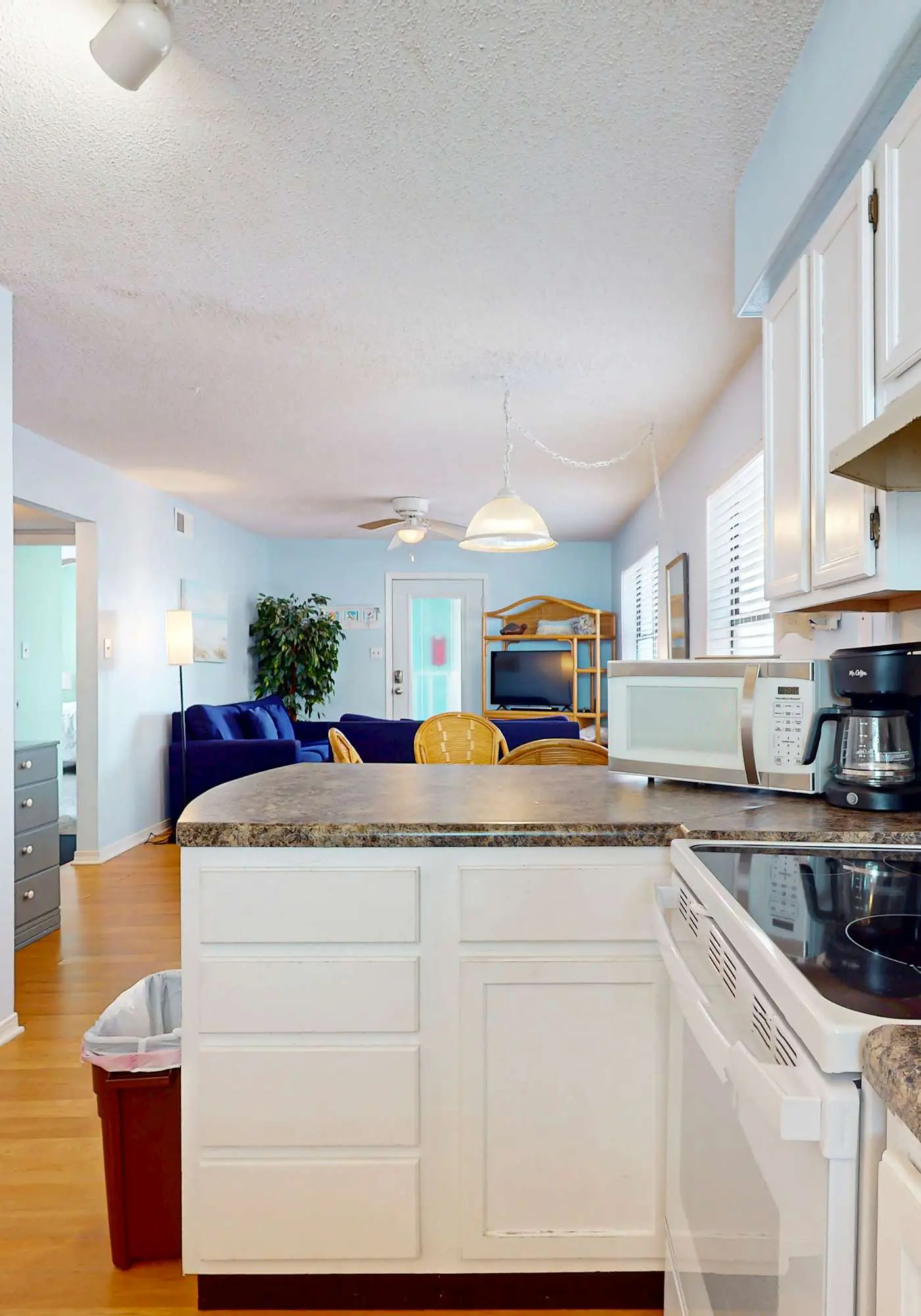 Waterfront condo with a furnished balcony, peek-a-boo Gulf views, & shared pools