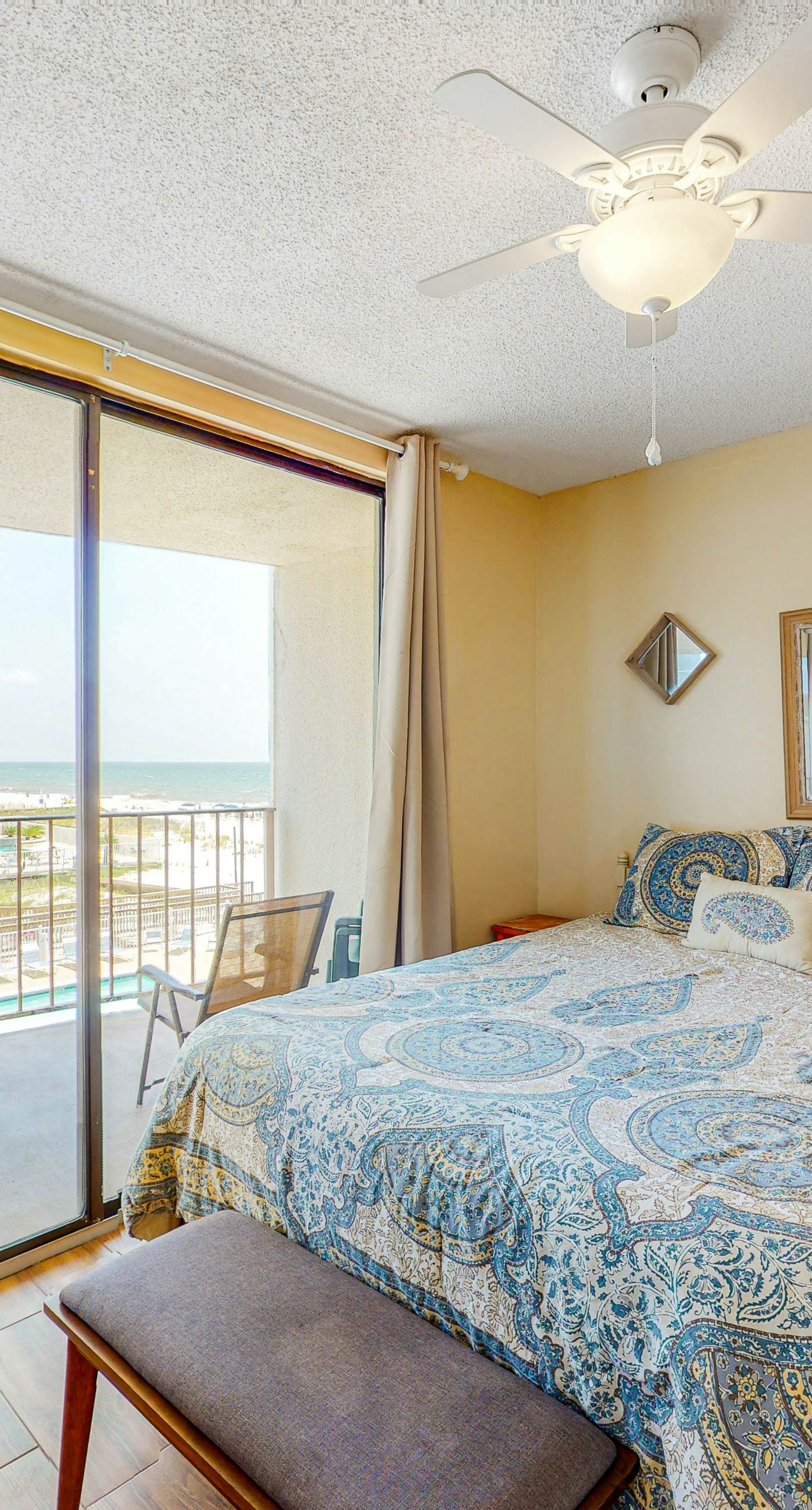 Beachfront condo with balcony overlooking Gulf of Mexico & resort pool
