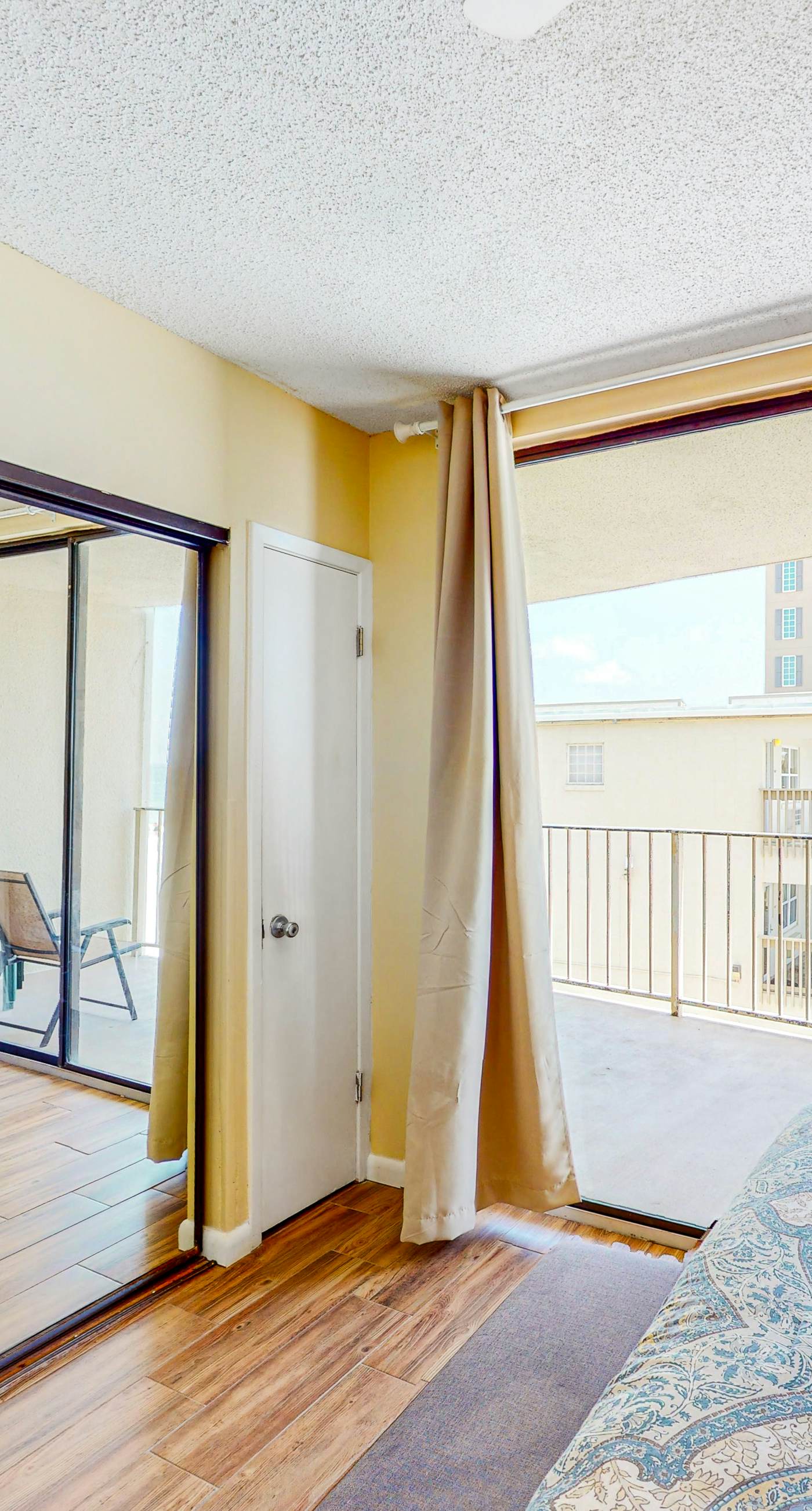 Beachfront condo with balcony overlooking Gulf of Mexico & resort pool