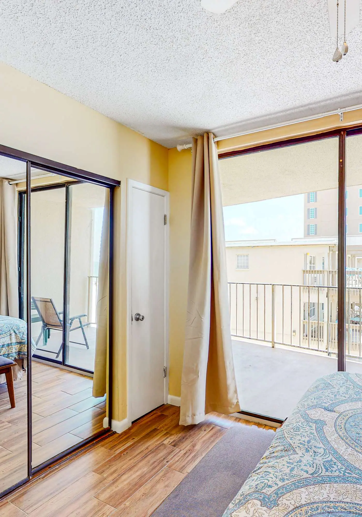 Beachfront condo with balcony overlooking Gulf of Mexico & resort pool