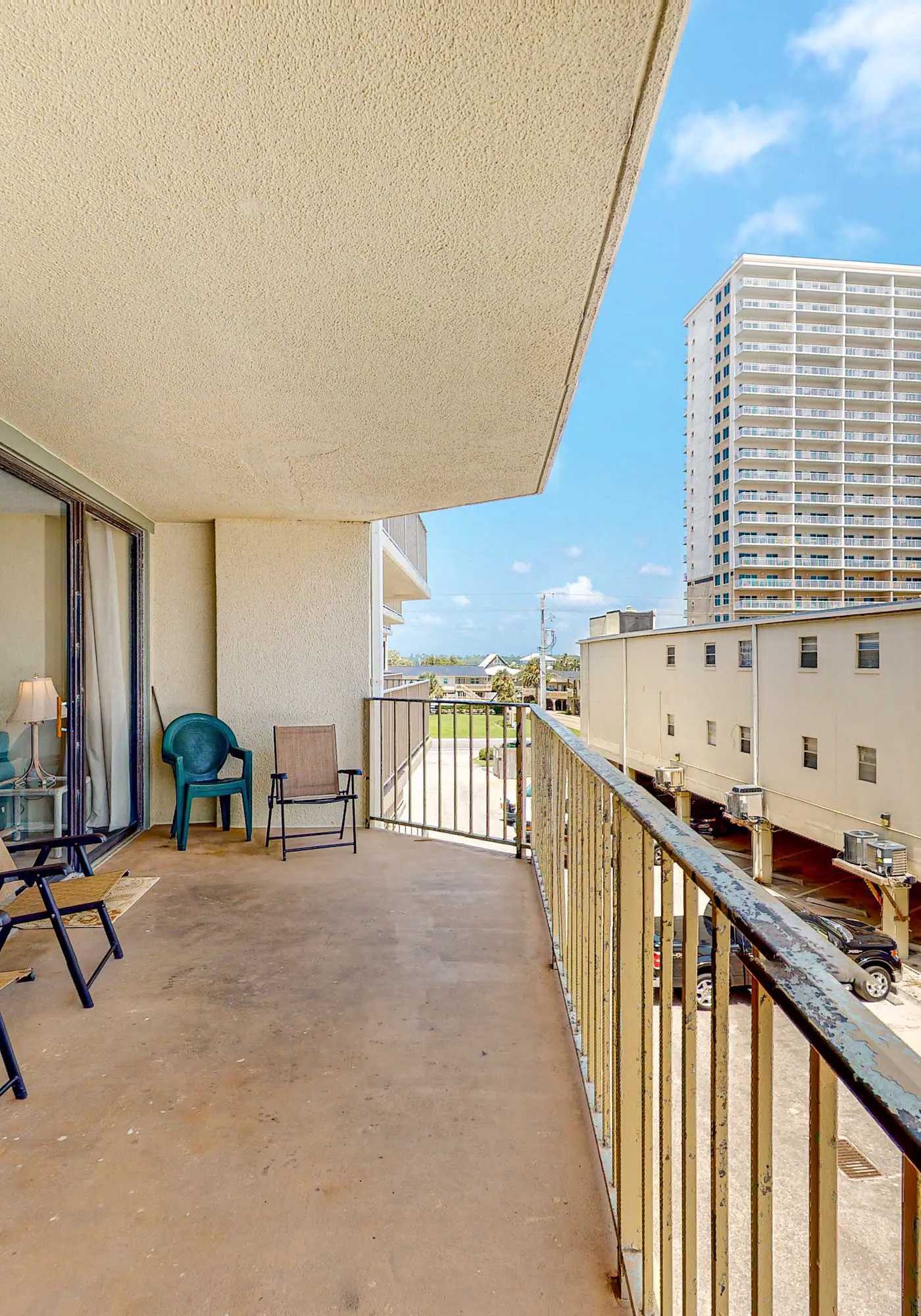 Beachfront condo with balcony overlooking Gulf of Mexico & resort pool