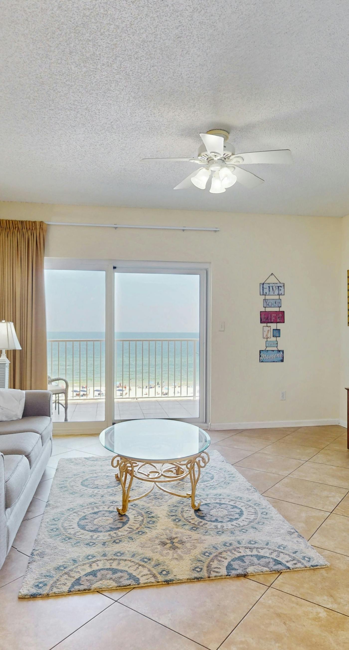 Beachfront, corner condo w a furnished balcony, shared pool, & grilling area