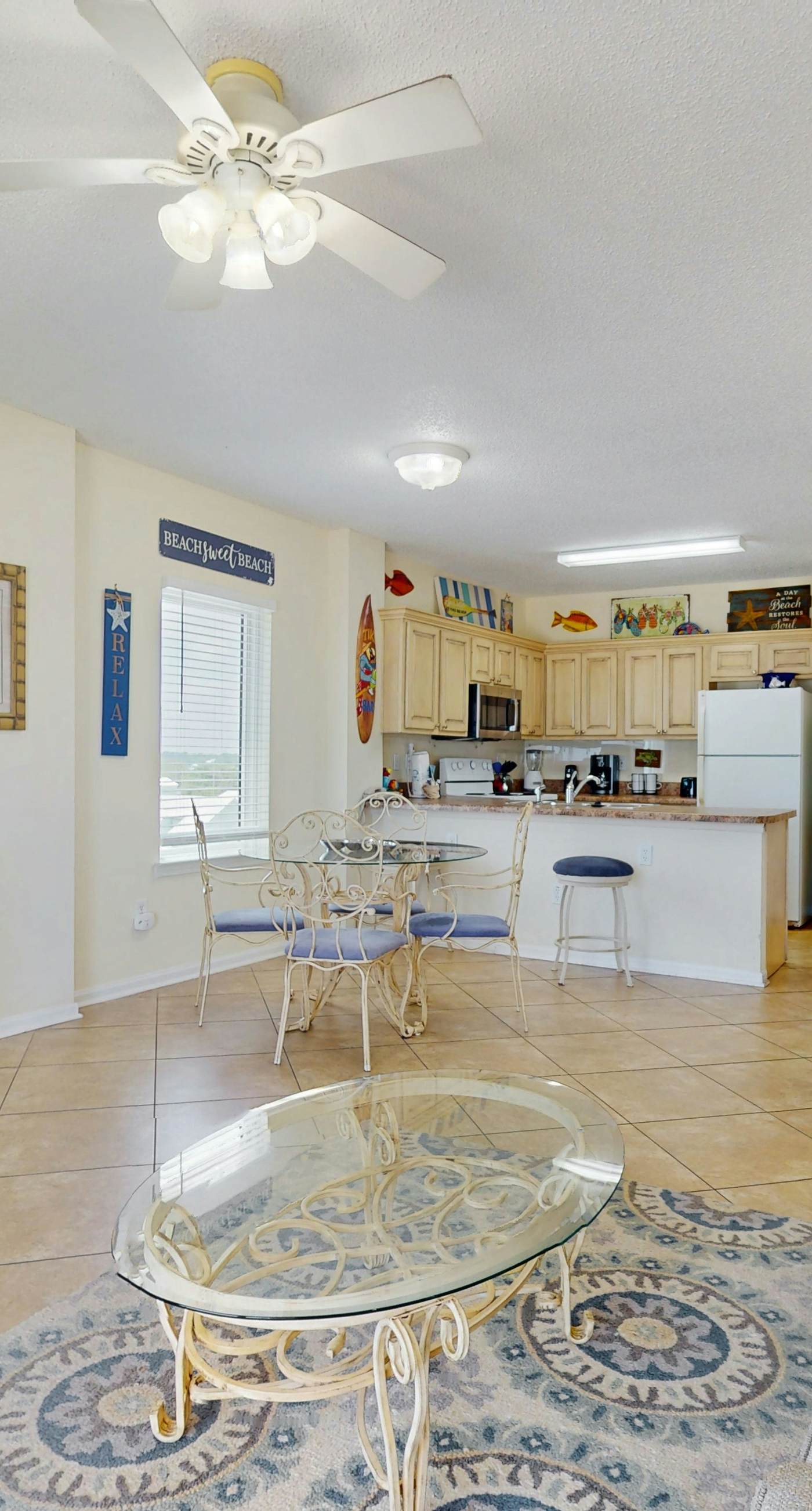 Beachfront, corner condo w a furnished balcony, shared pool, & grilling area