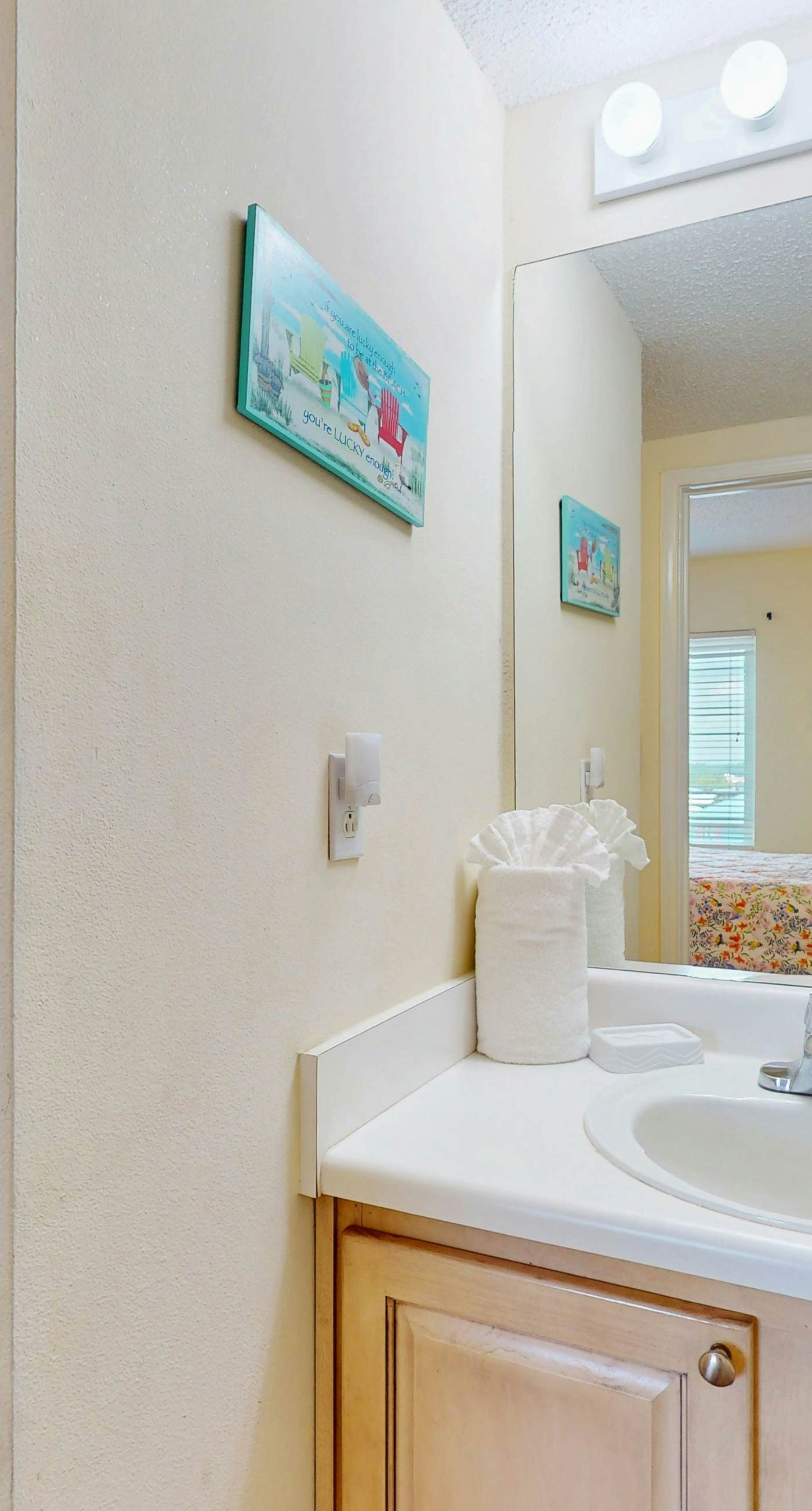 Beachfront, corner condo w a furnished balcony, shared pool, & grilling area