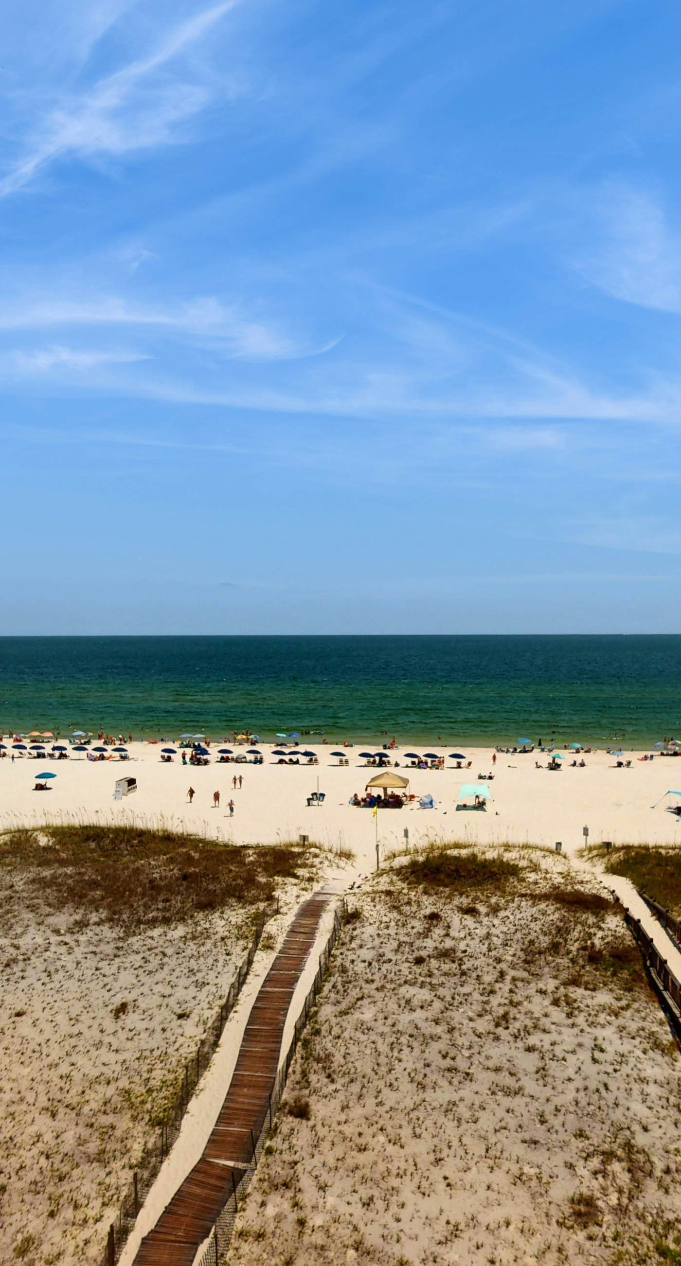 Beachfront, corner condo w a furnished balcony, shared pool, & grilling area